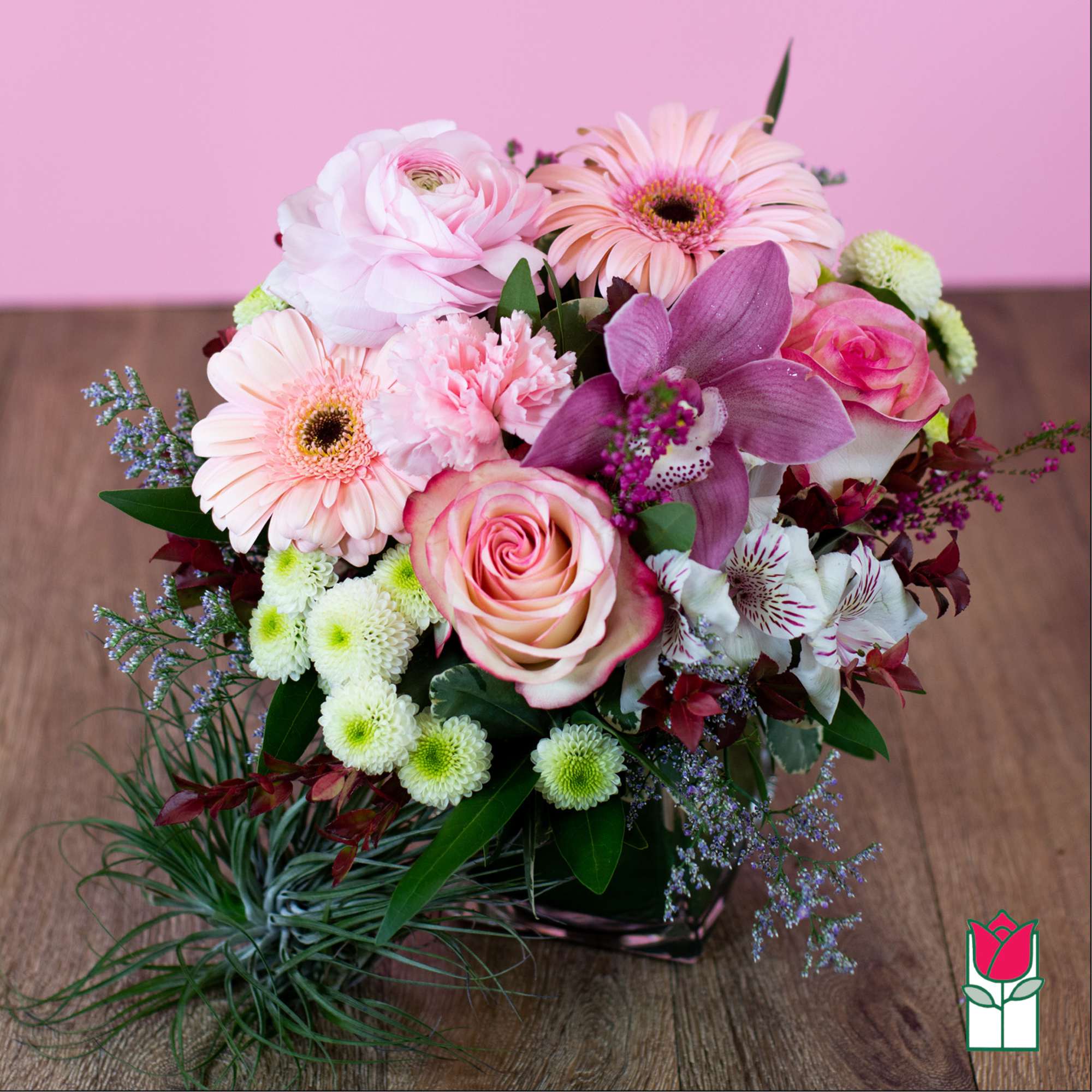 Pink and white mixed bouquet with roses, gerbera daisies, and orchids
