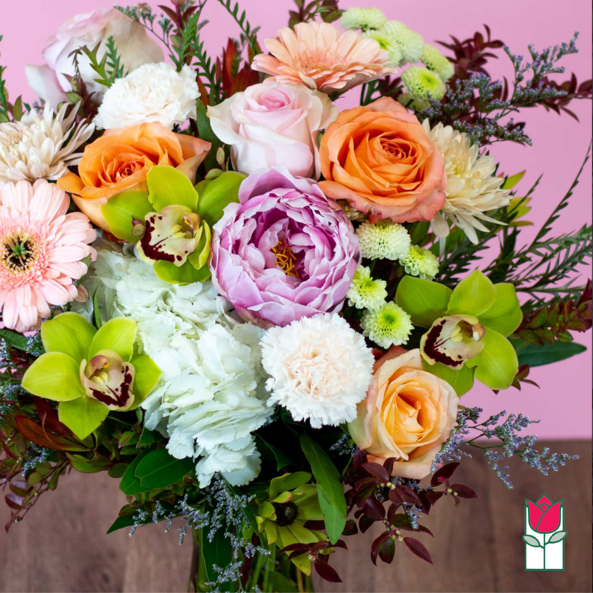 Mixed bouquet of roses, peonies, orchids, and chrysanthemums