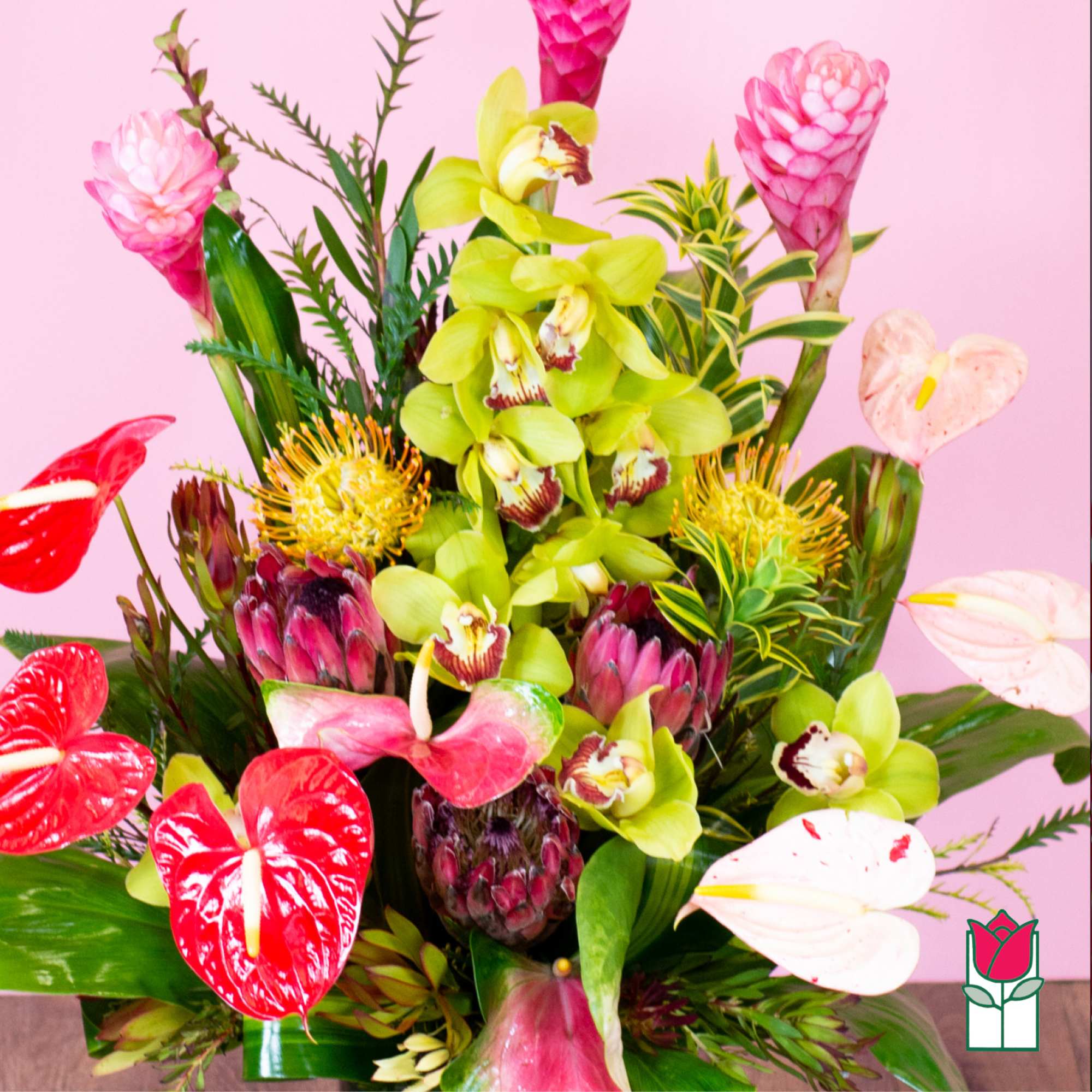 Tropical bouquet with orchids, anthuriums, and pink ginger flowers
