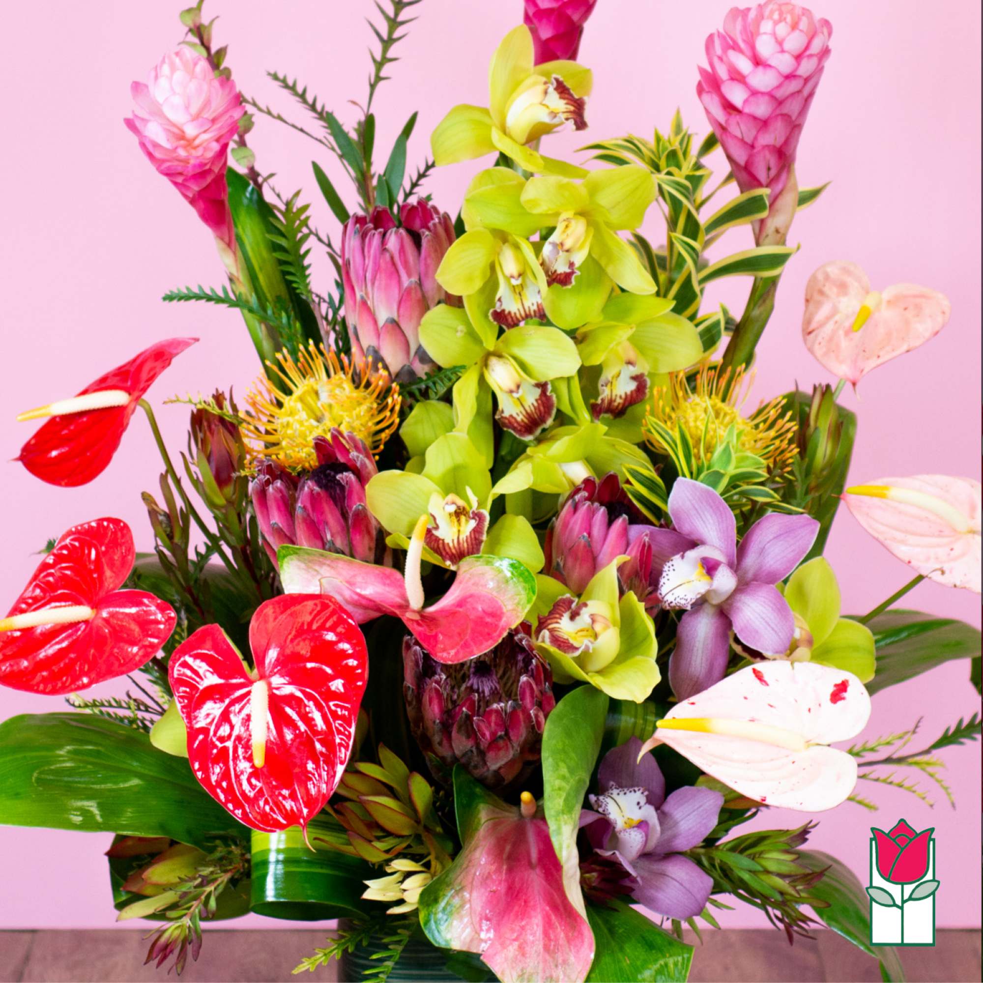 Tropical bouquet with orchids, anthuriums, and pink ginger flowers