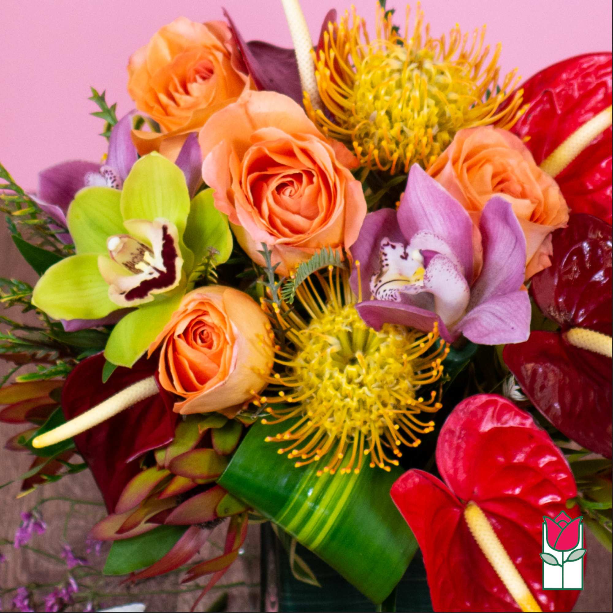 Bouquet of orange roses, orchids, and yellow pincushion blooms