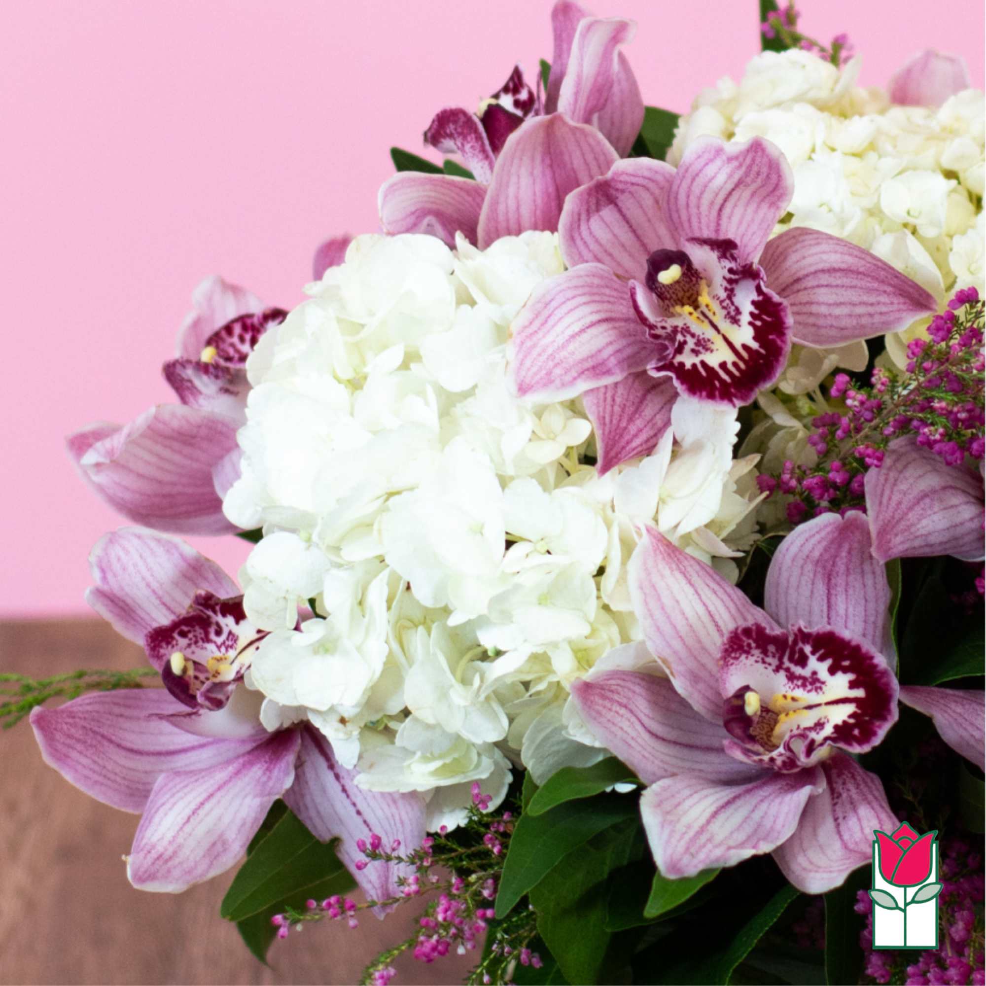 Pink orchids with white hydrangeas in a bouquet