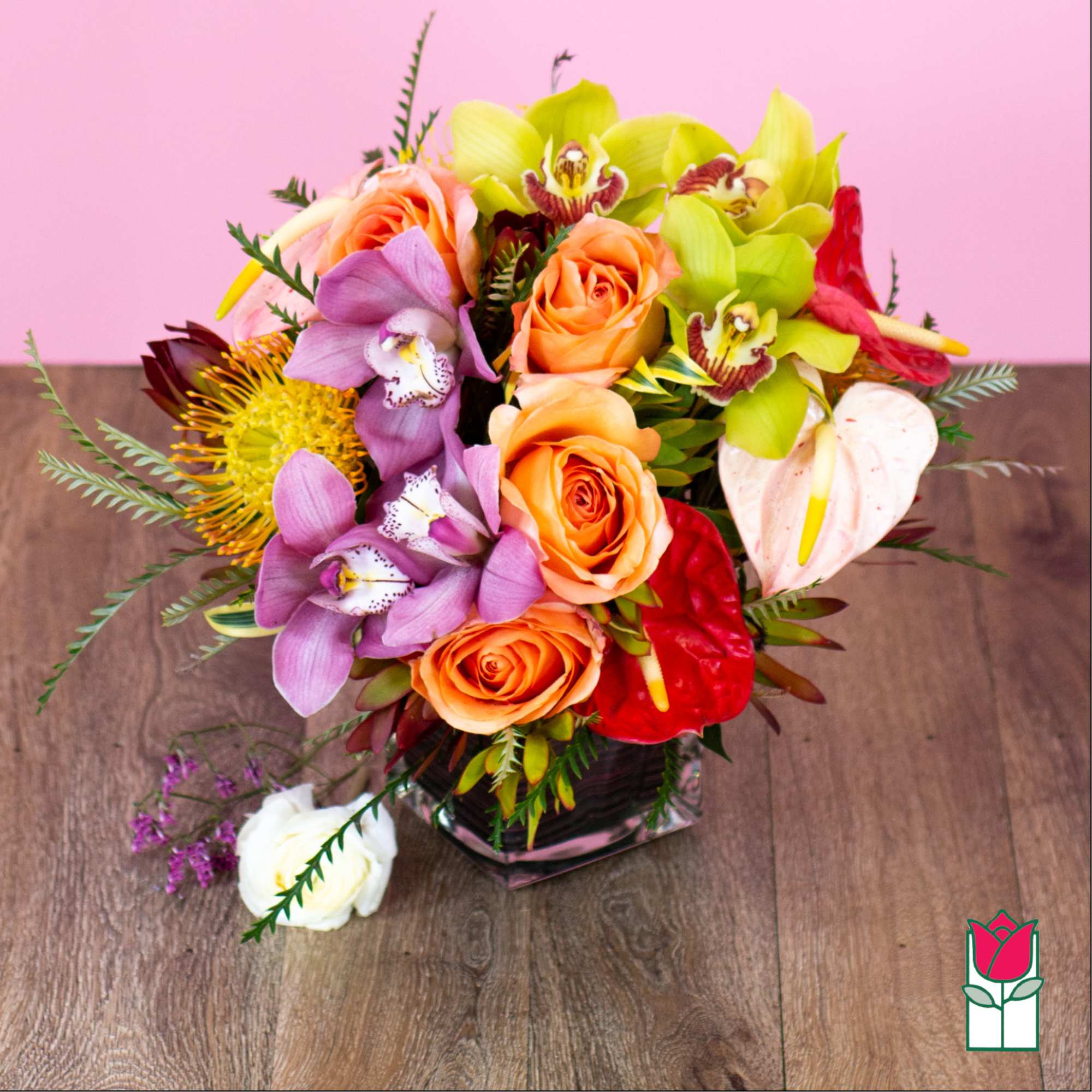 Mixed bouquet with roses, orchids, and anthuriums in a glass vase, photo 2 of 5
