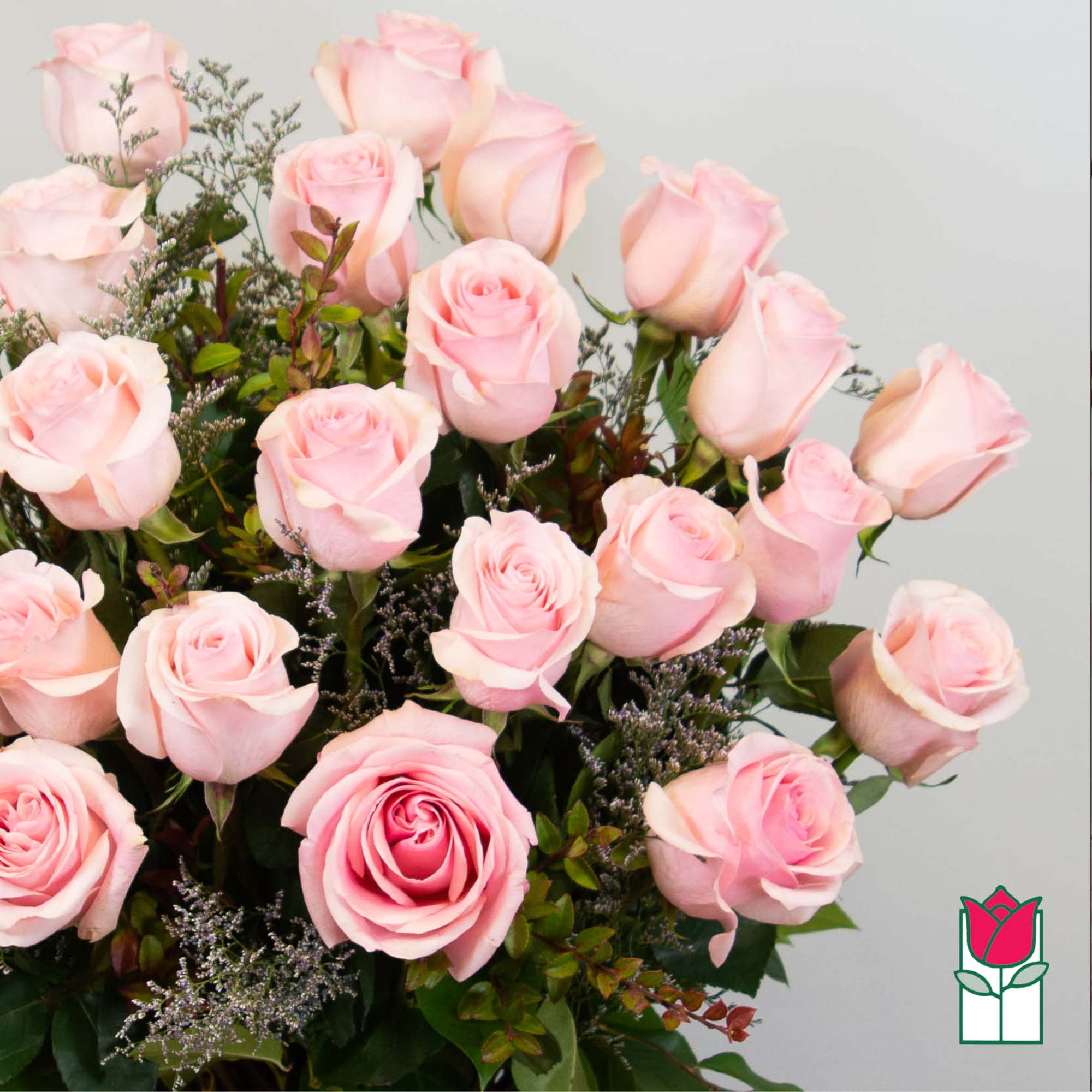 Bouquet of pale pink roses with small filler flowers