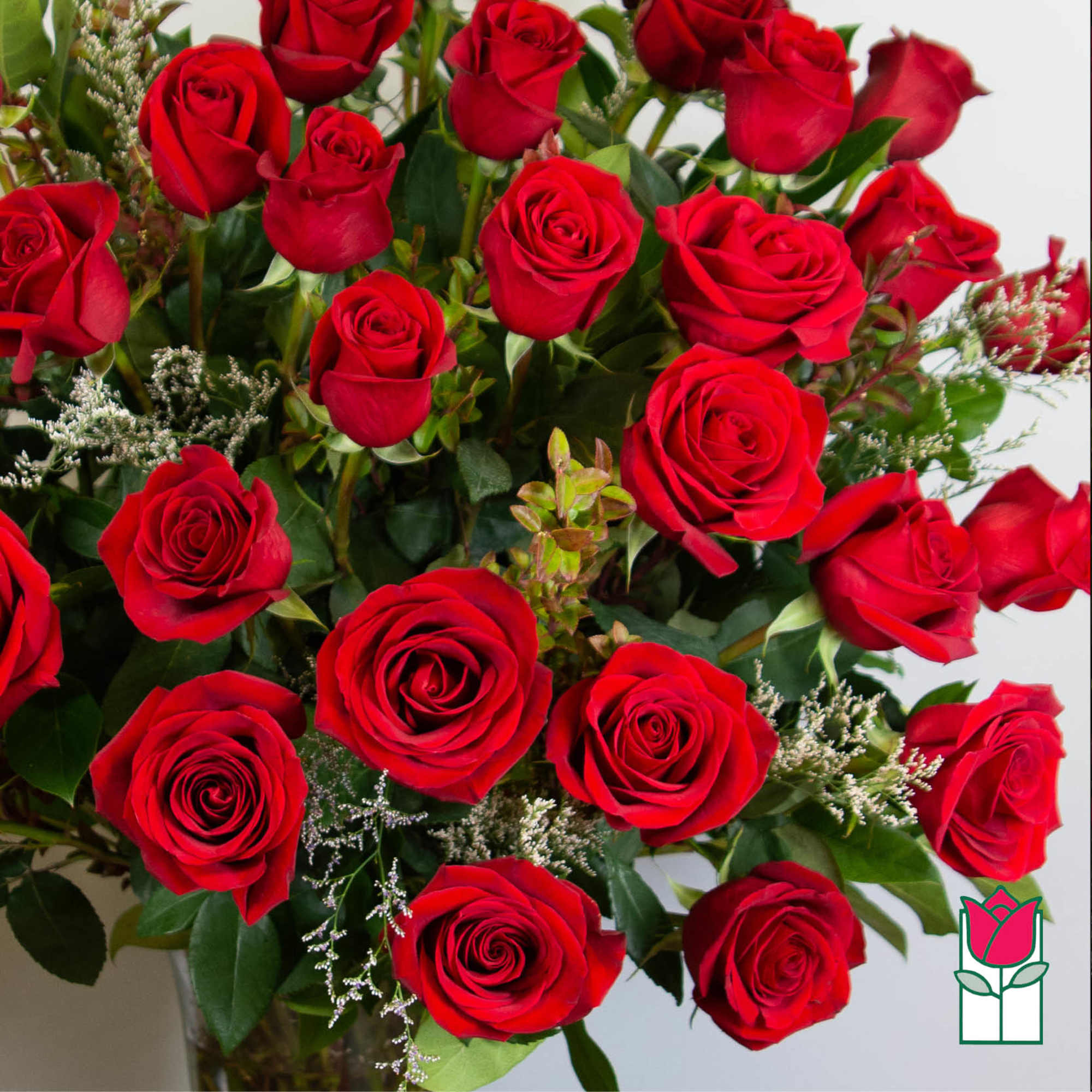 Bouquet of red roses with small filler flowers