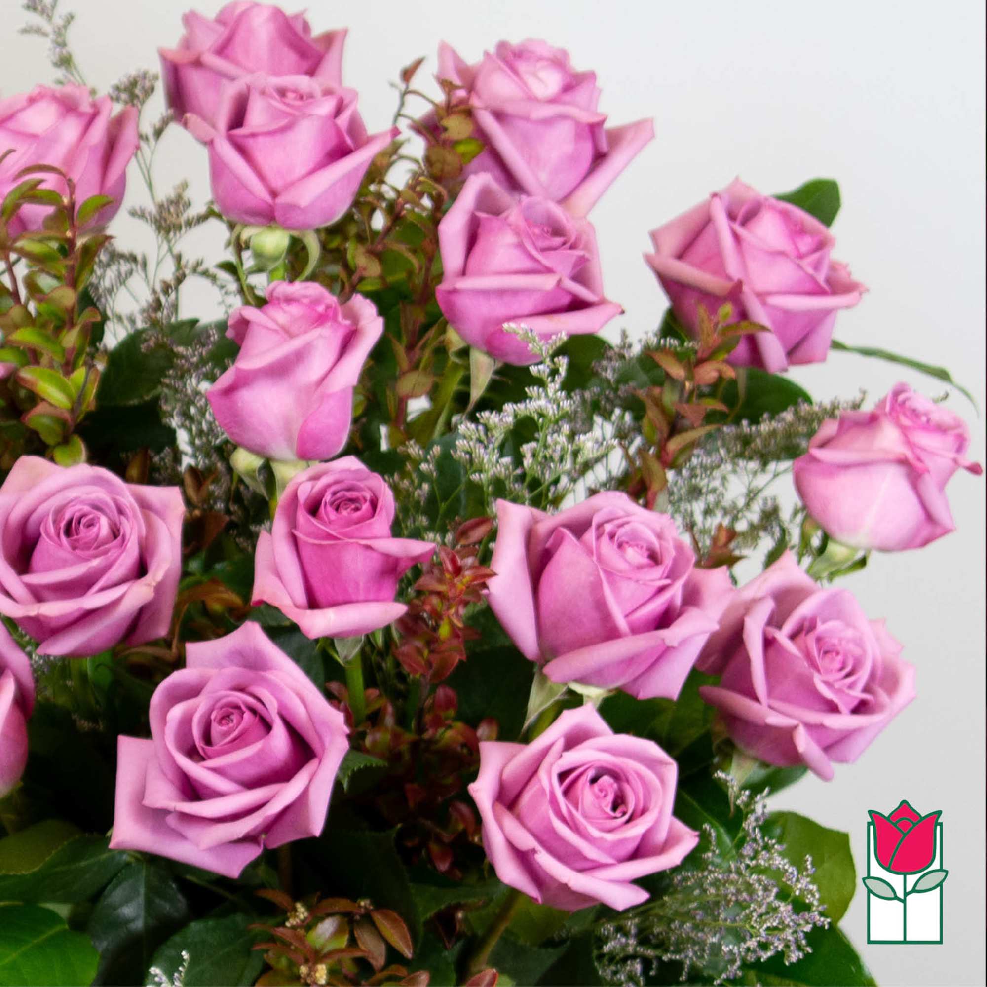 Bouquet of pink roses with mixed greenery