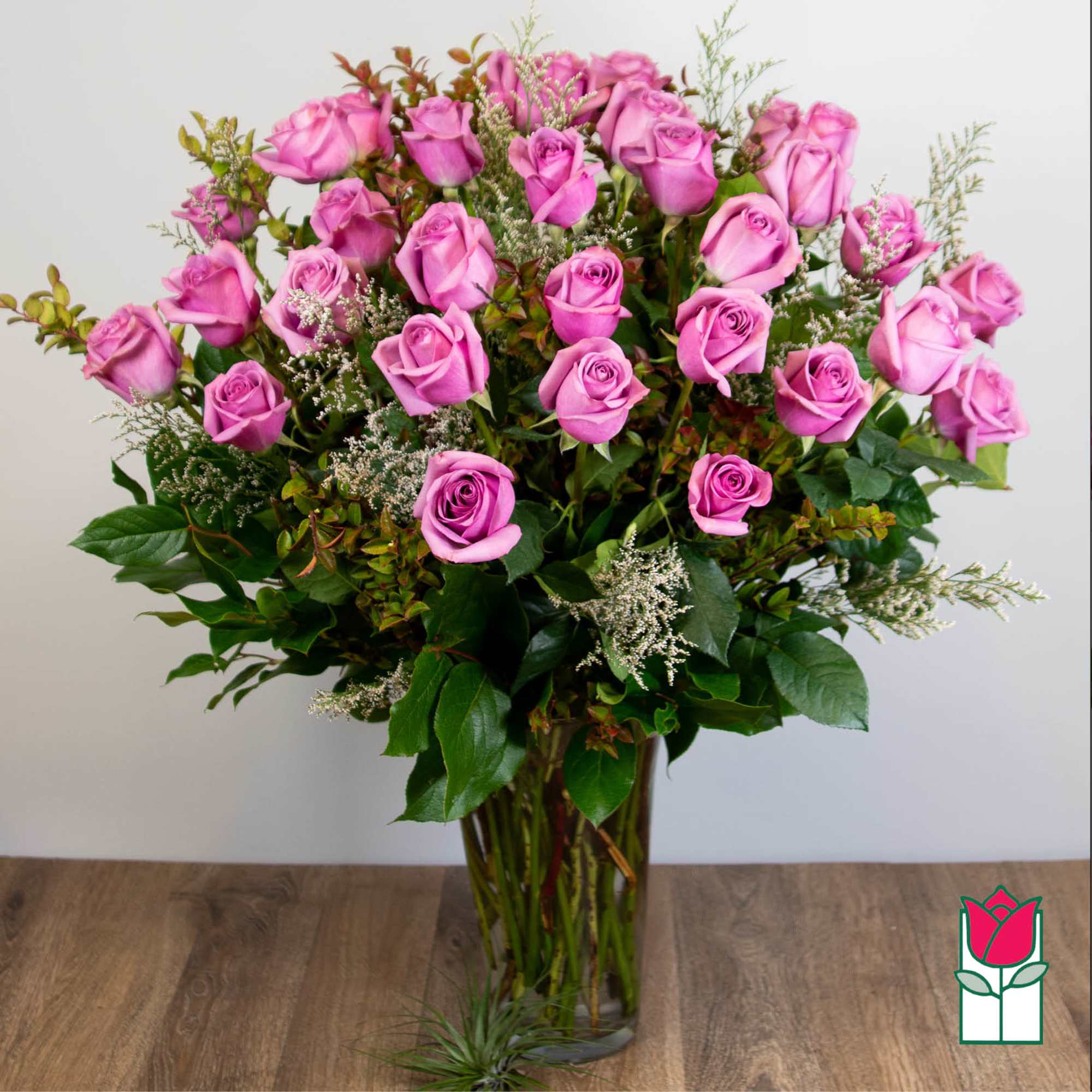 Bouquet of pink roses in a clear glass vase