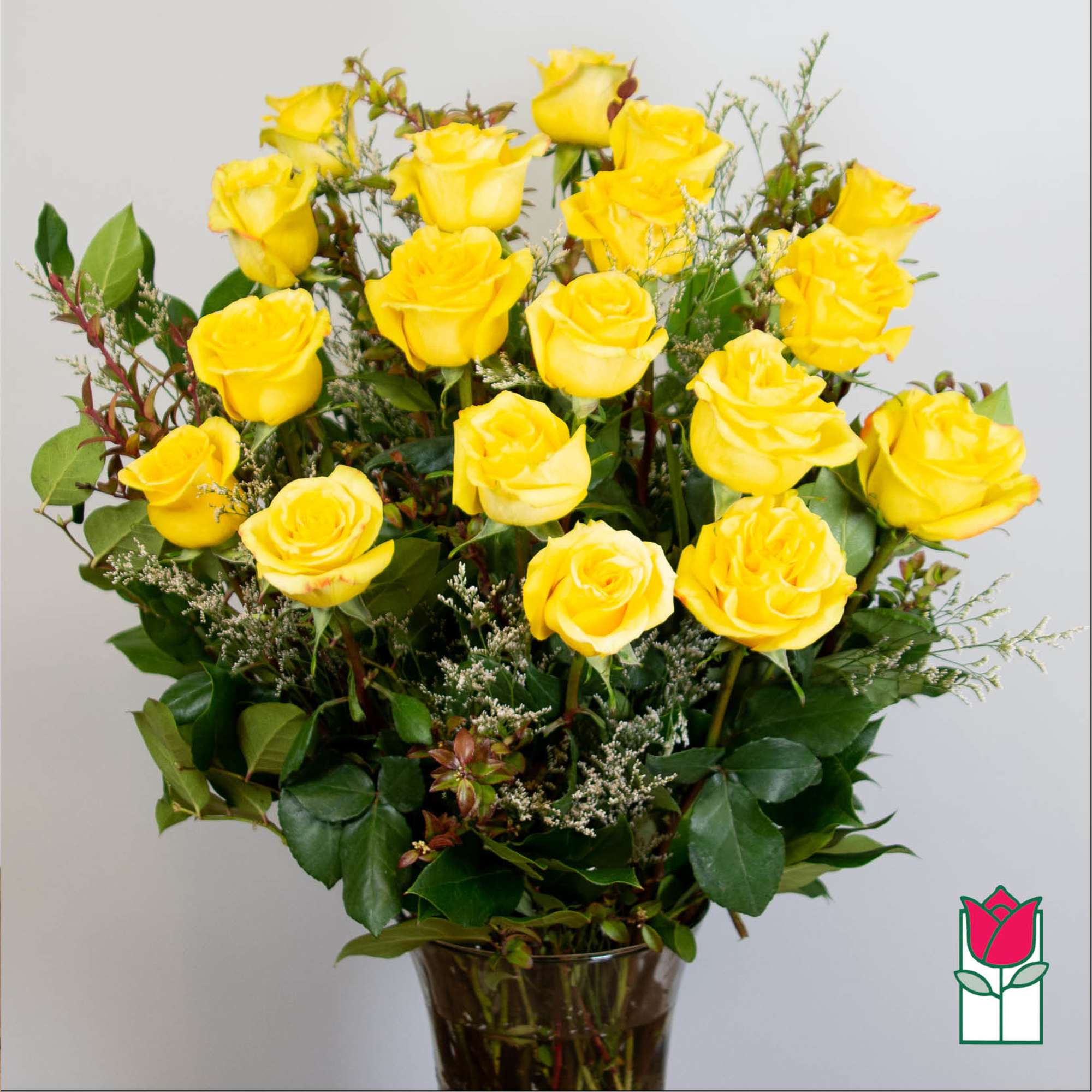 Bouquet of yellow roses in a glass vase