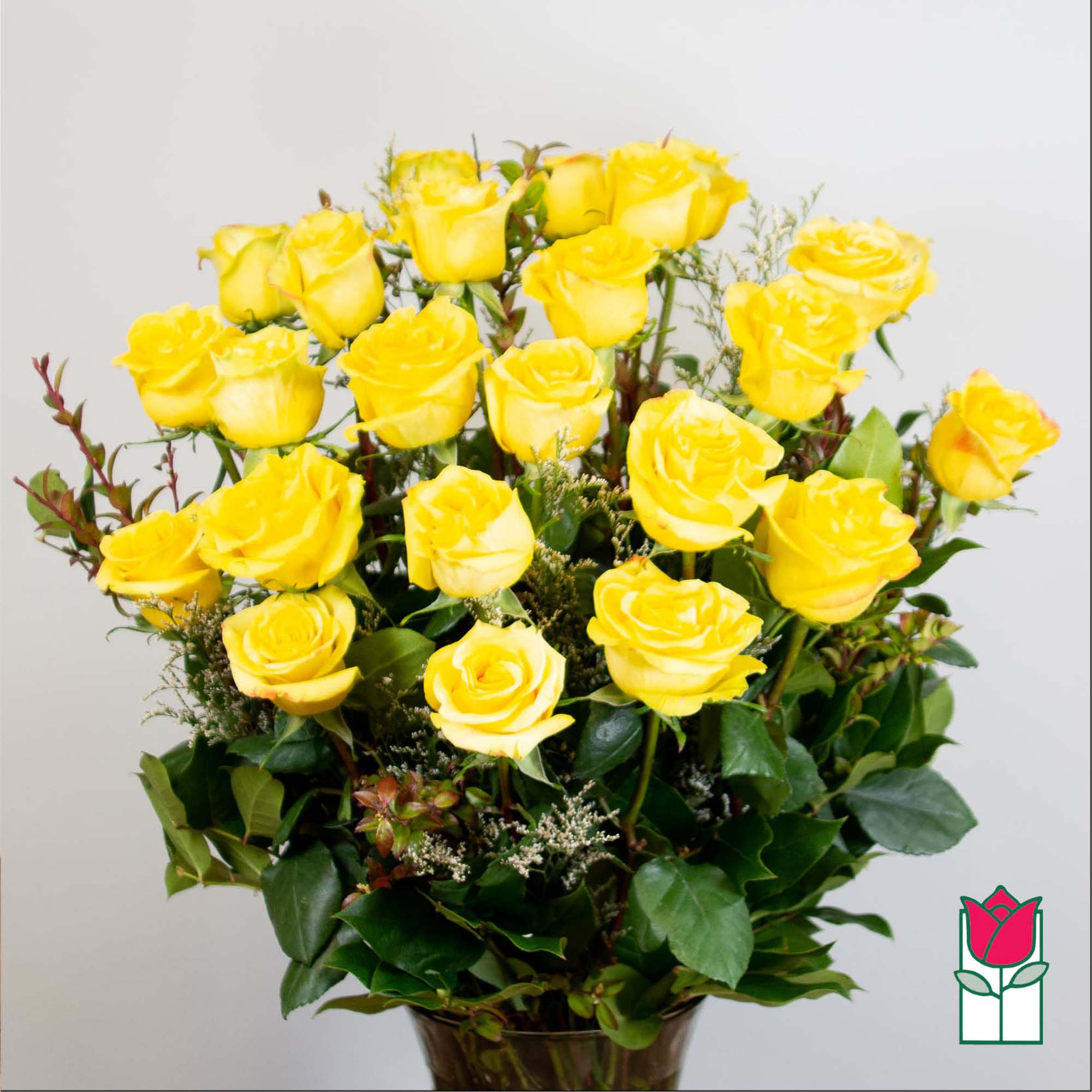 Bouquet of yellow roses in a glass vase