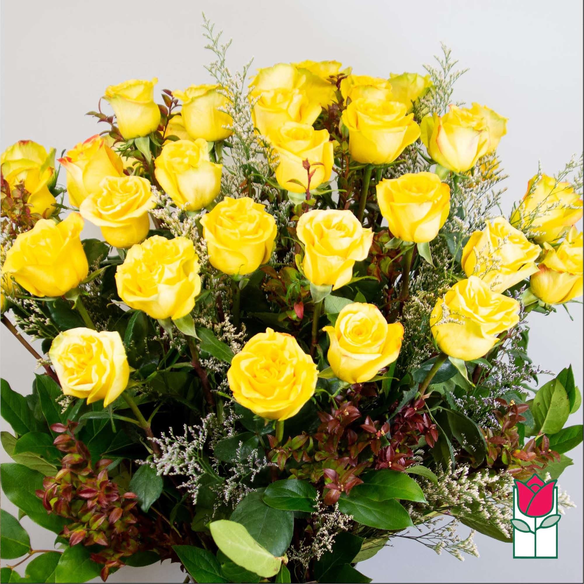 Bouquet of yellow roses with mixed greenery