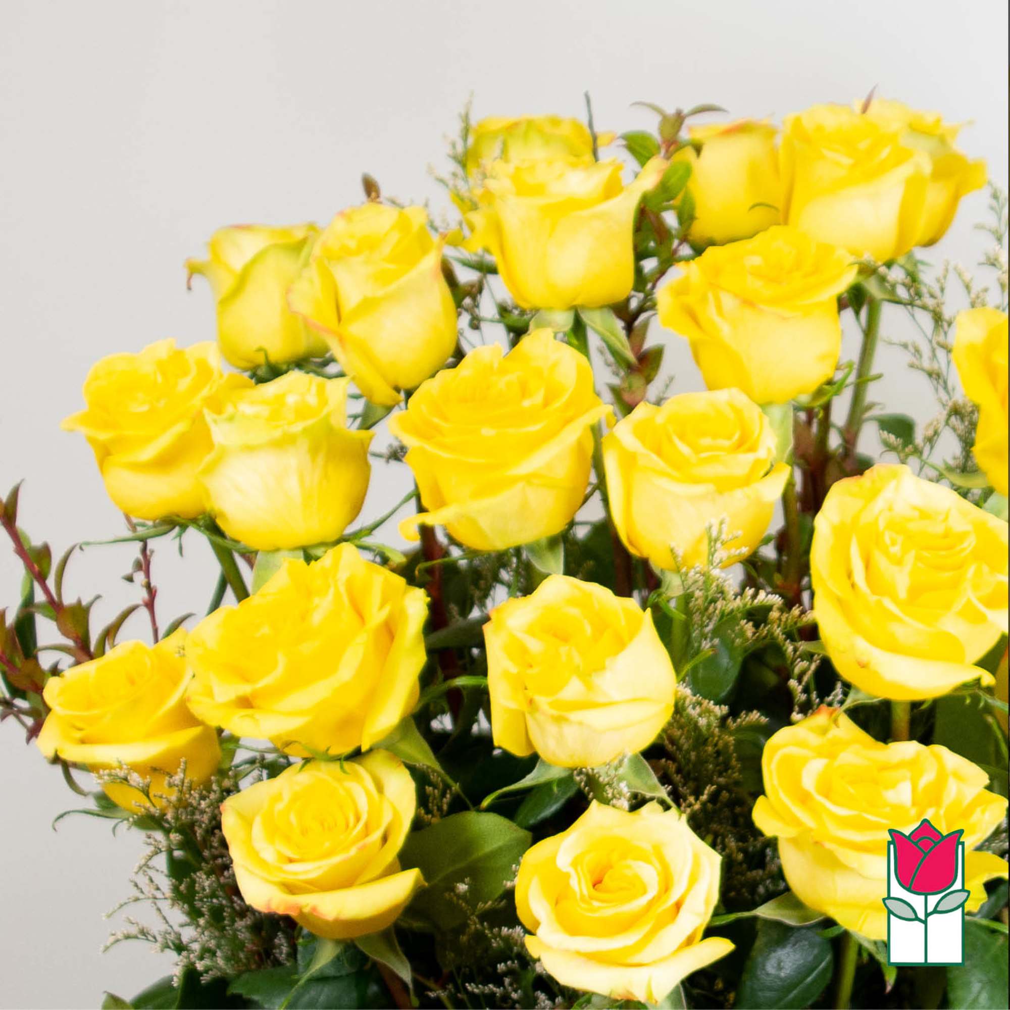 Bouquet of yellow roses with greenery