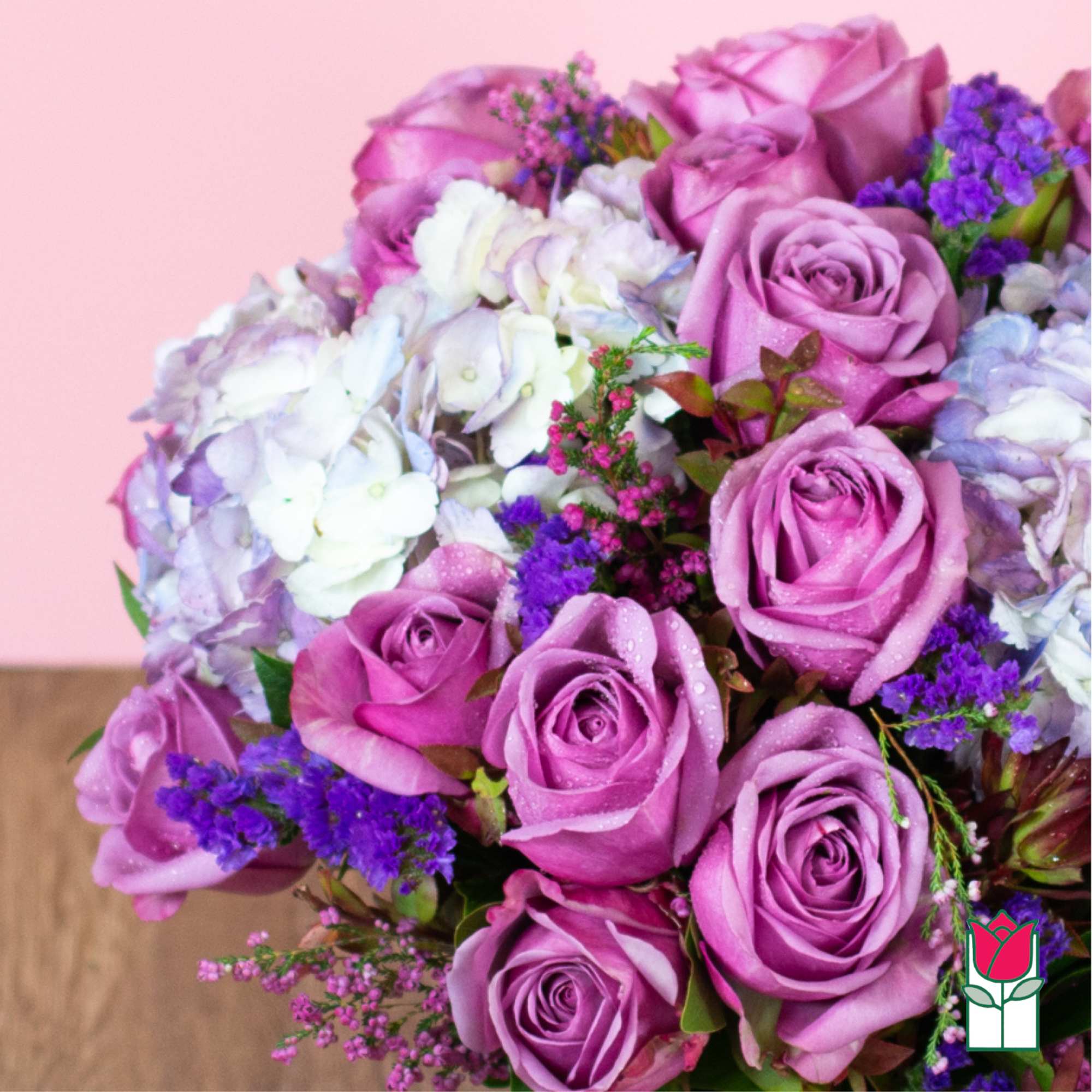 Bouquet of lavender roses and white hydrangeas with purple filler flowers