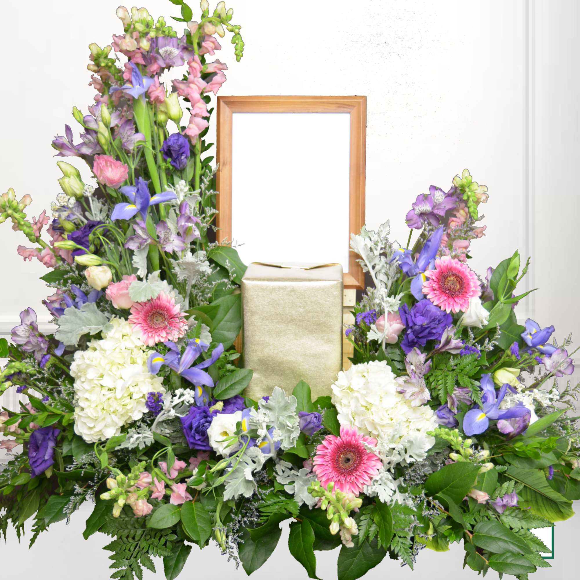 Large floral arrangement with pink, purple, and white flowers around a gold urn