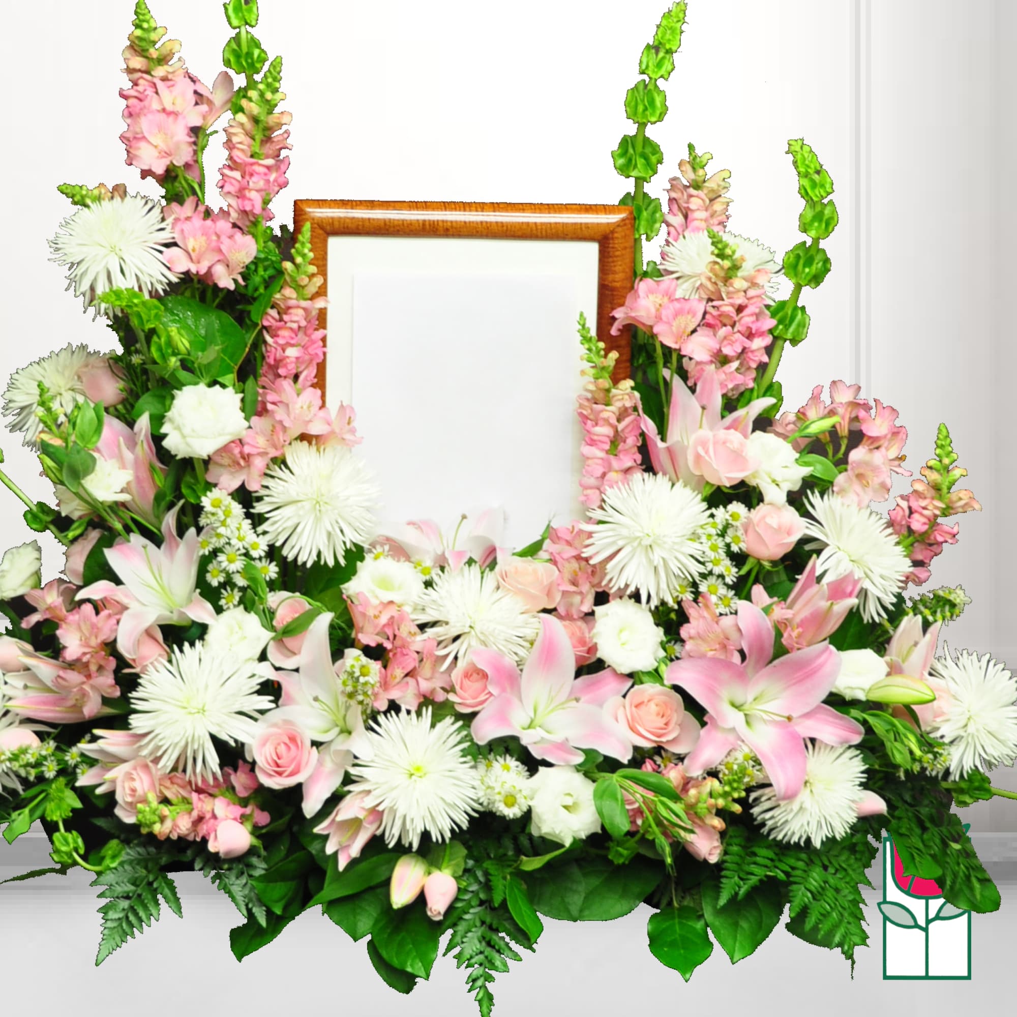 Pink and white floral frame arrangement around a wooden picture frame