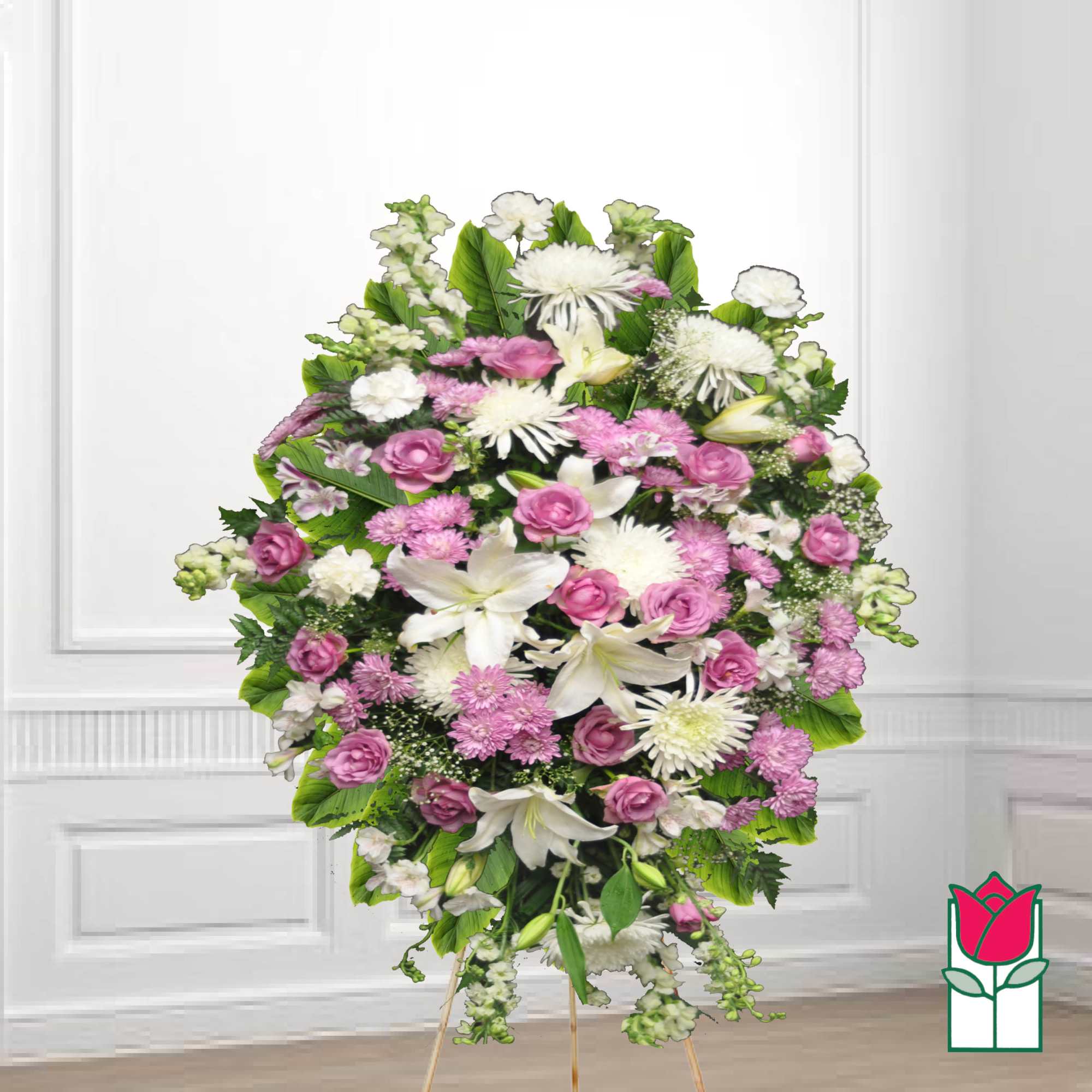 Standing funeral spray with pink and white flowers on a tripod easel