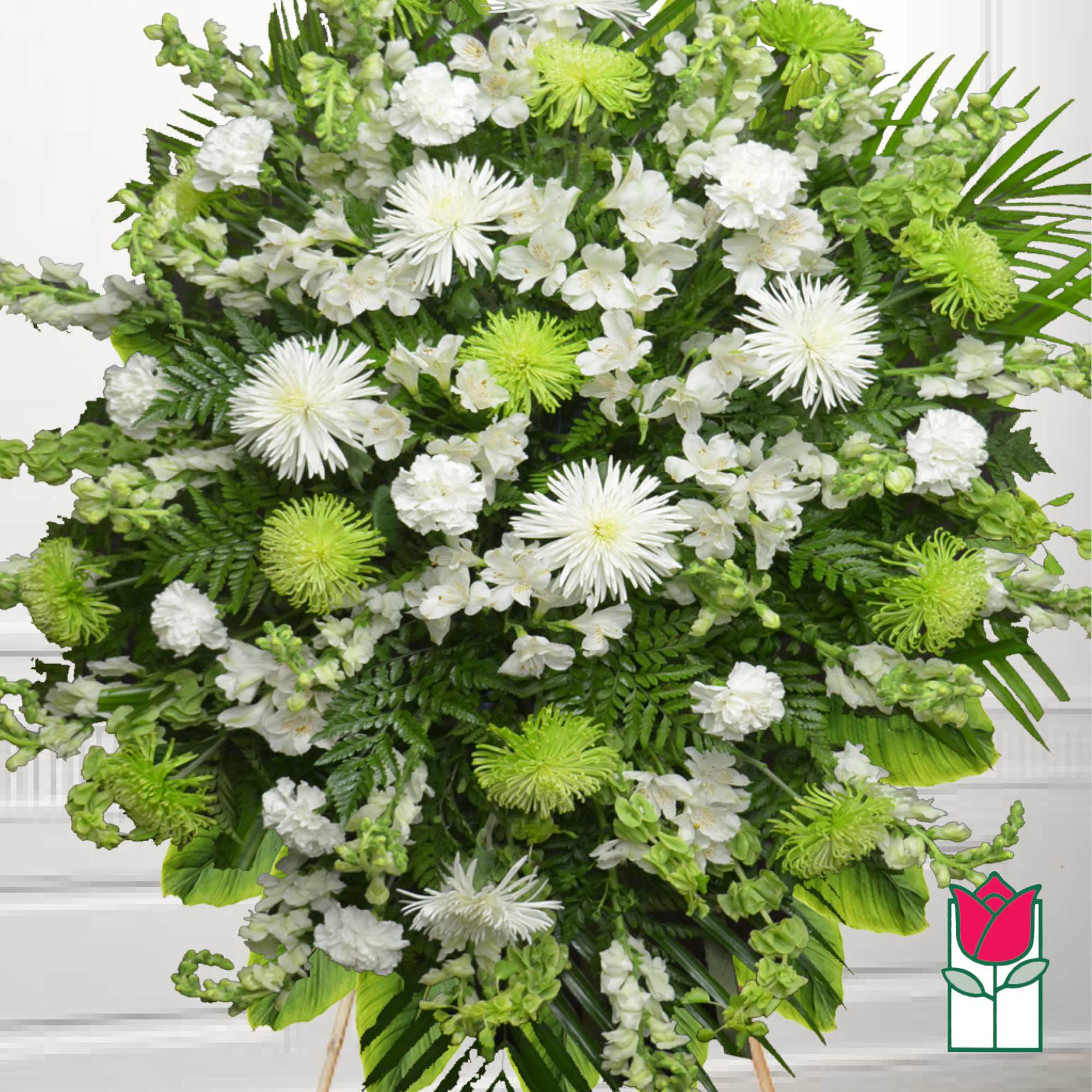 Large white and green funeral spray with chrysanthemums and lilies