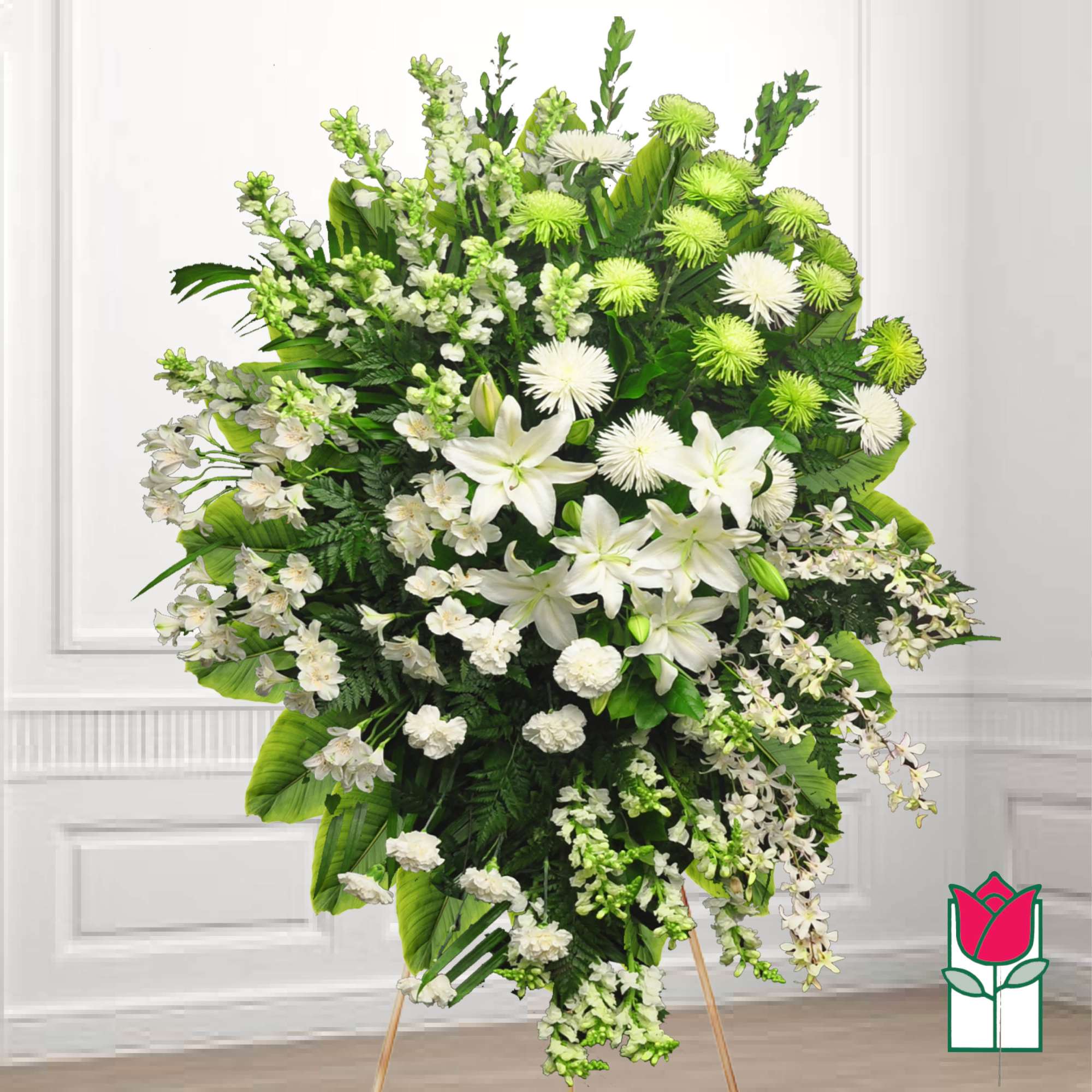 Large white and green funeral spray with lilies and chrysanthemums