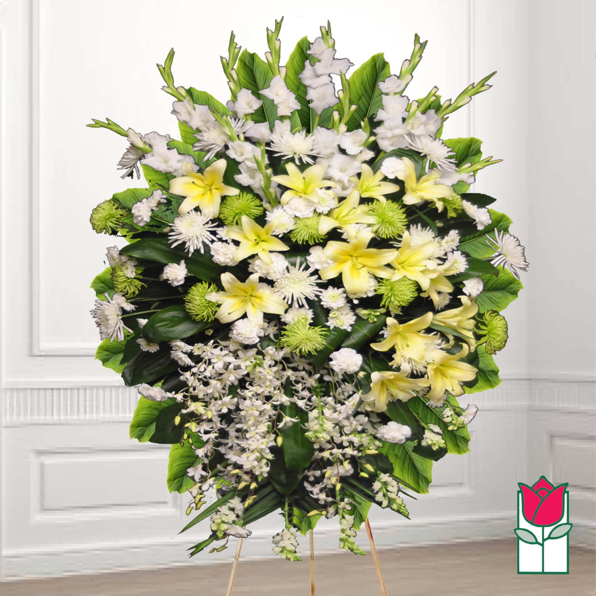 Standing funeral spray with yellow lilies and white flowers on a tripod easel