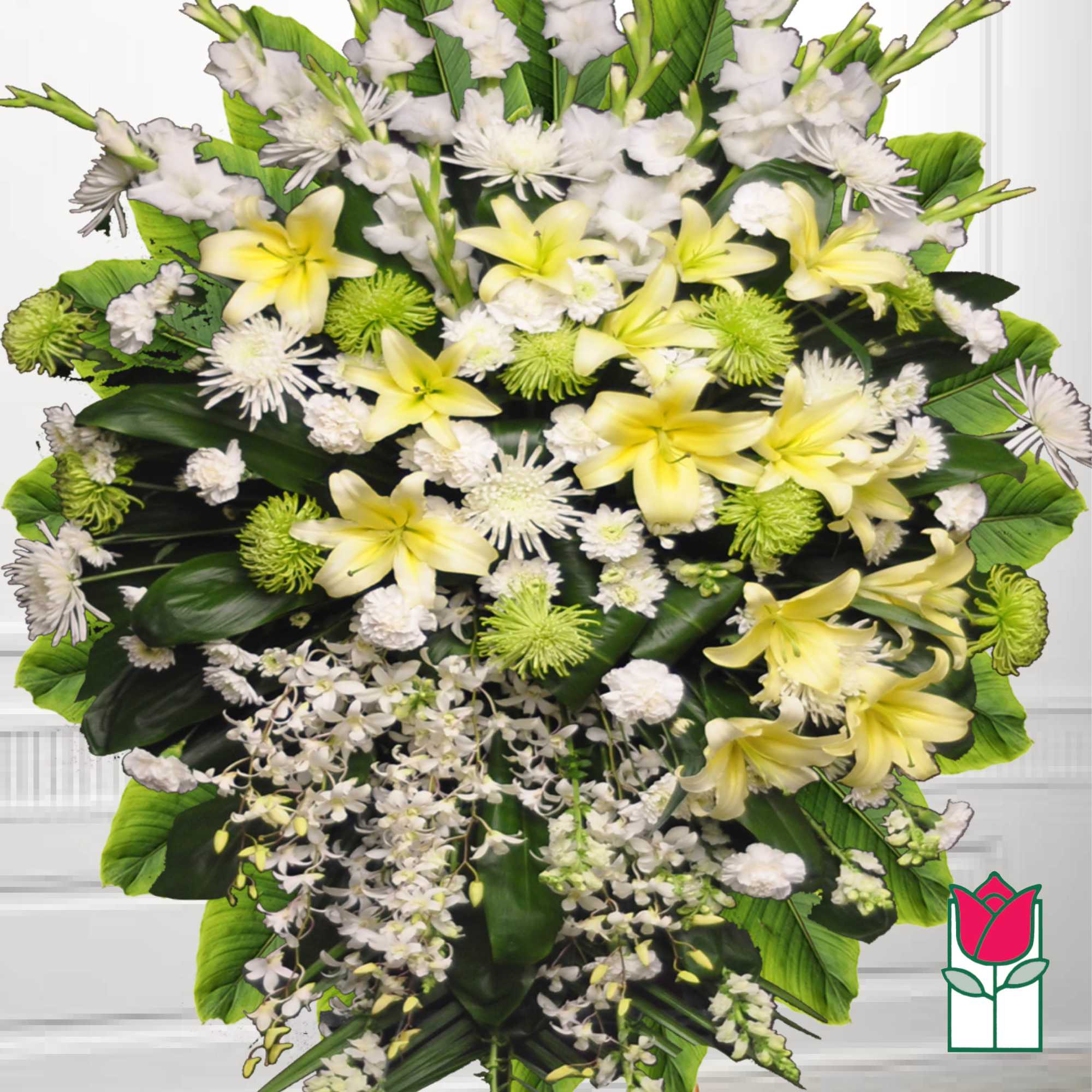 Large floral spray with yellow lilies, white flowers, and green accents