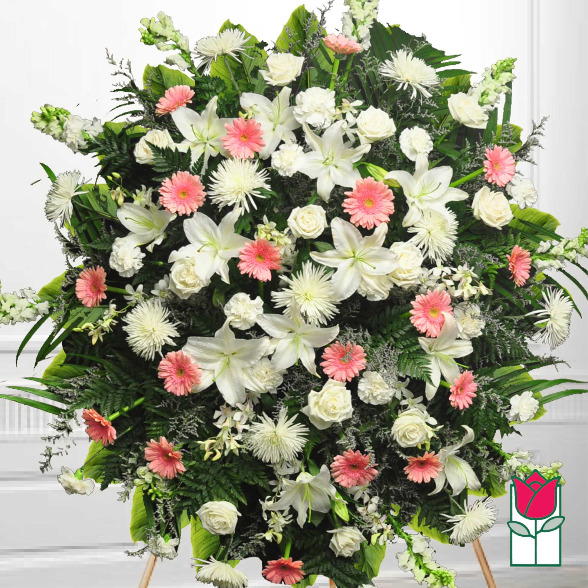 Large standing spray of white lilies, roses, and pink daisies