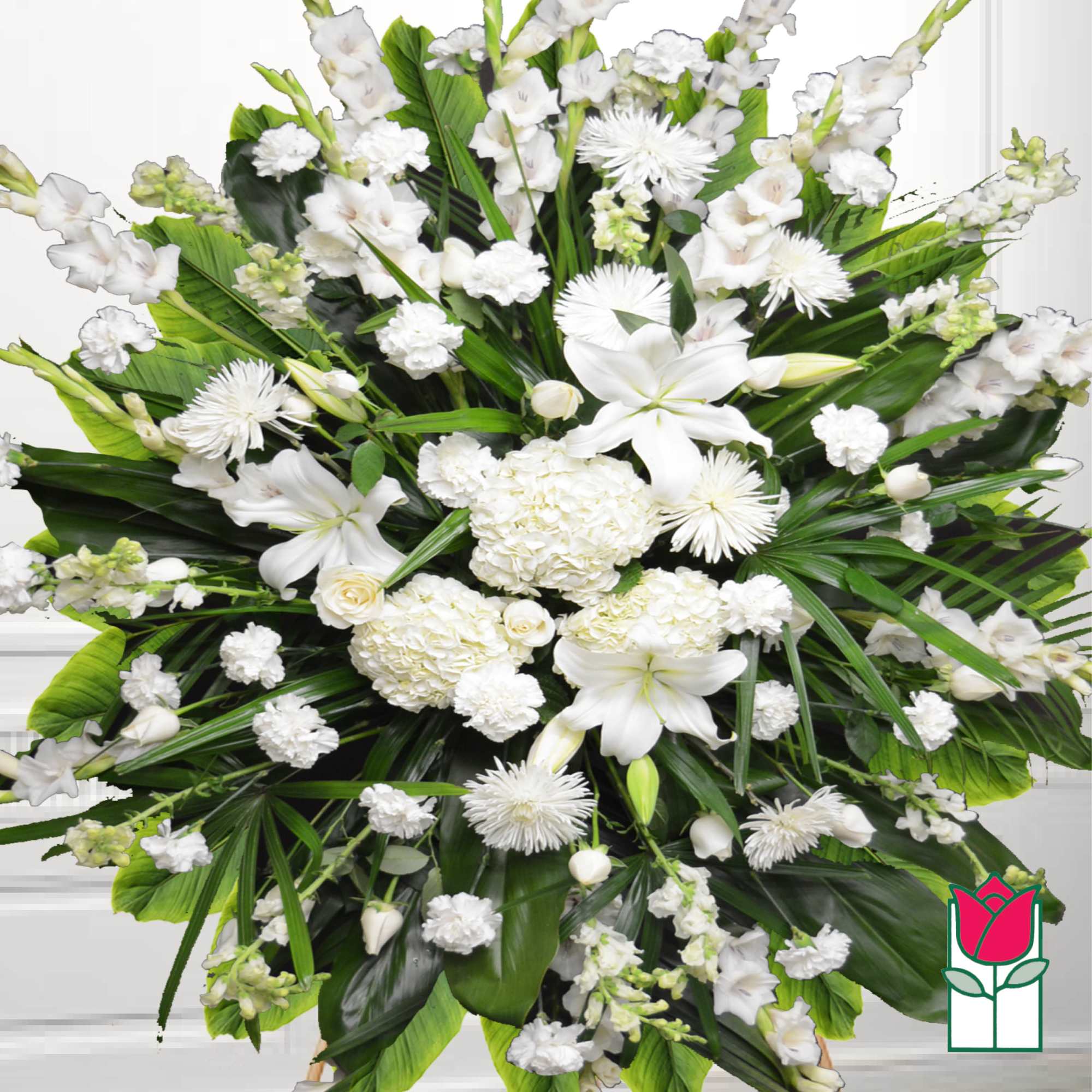 Large white funeral spray with lilies and chrysanthemums