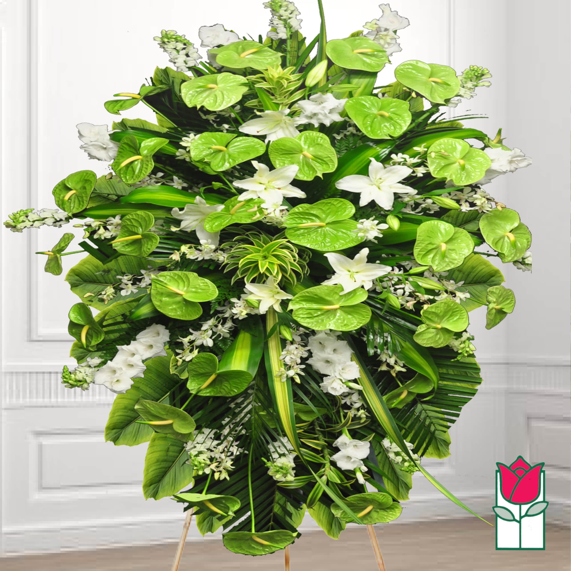 Large green and white floral standing spray with lilies and anthuriums