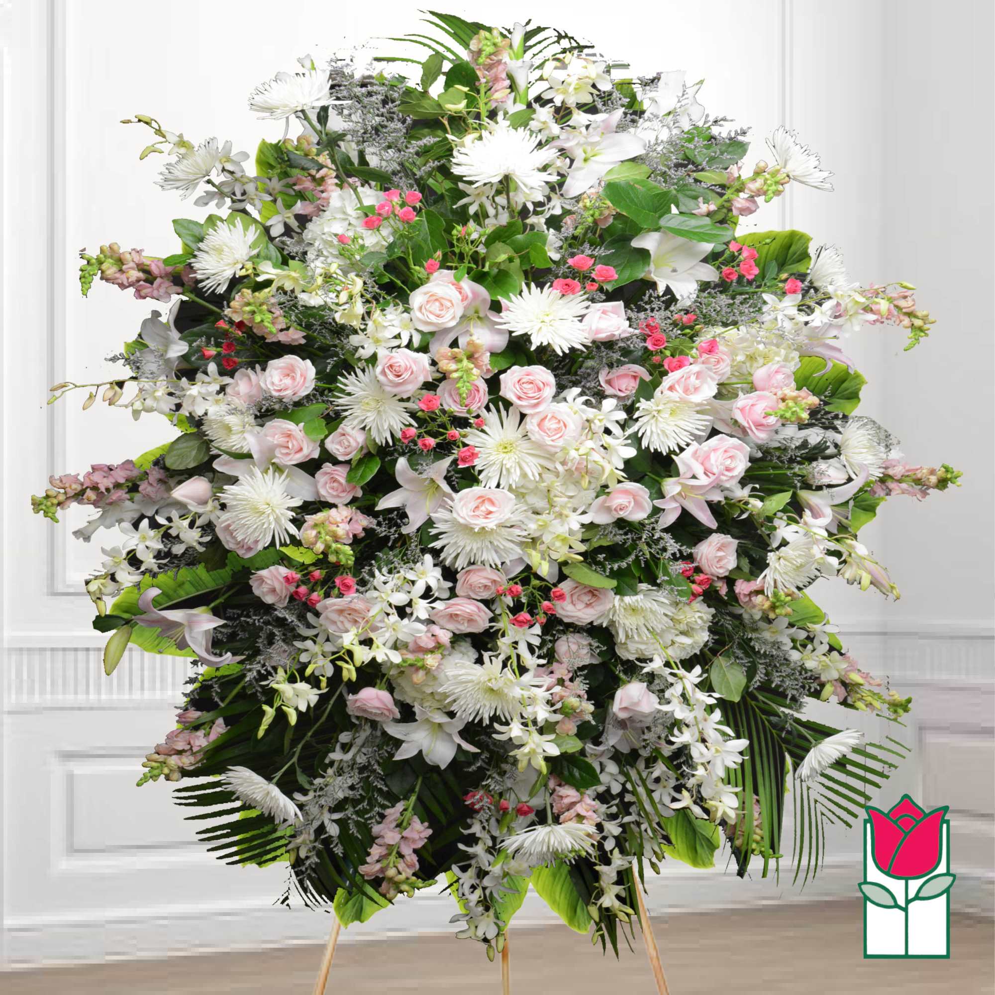 Large standing floral spray with pink and white flowers on an easel