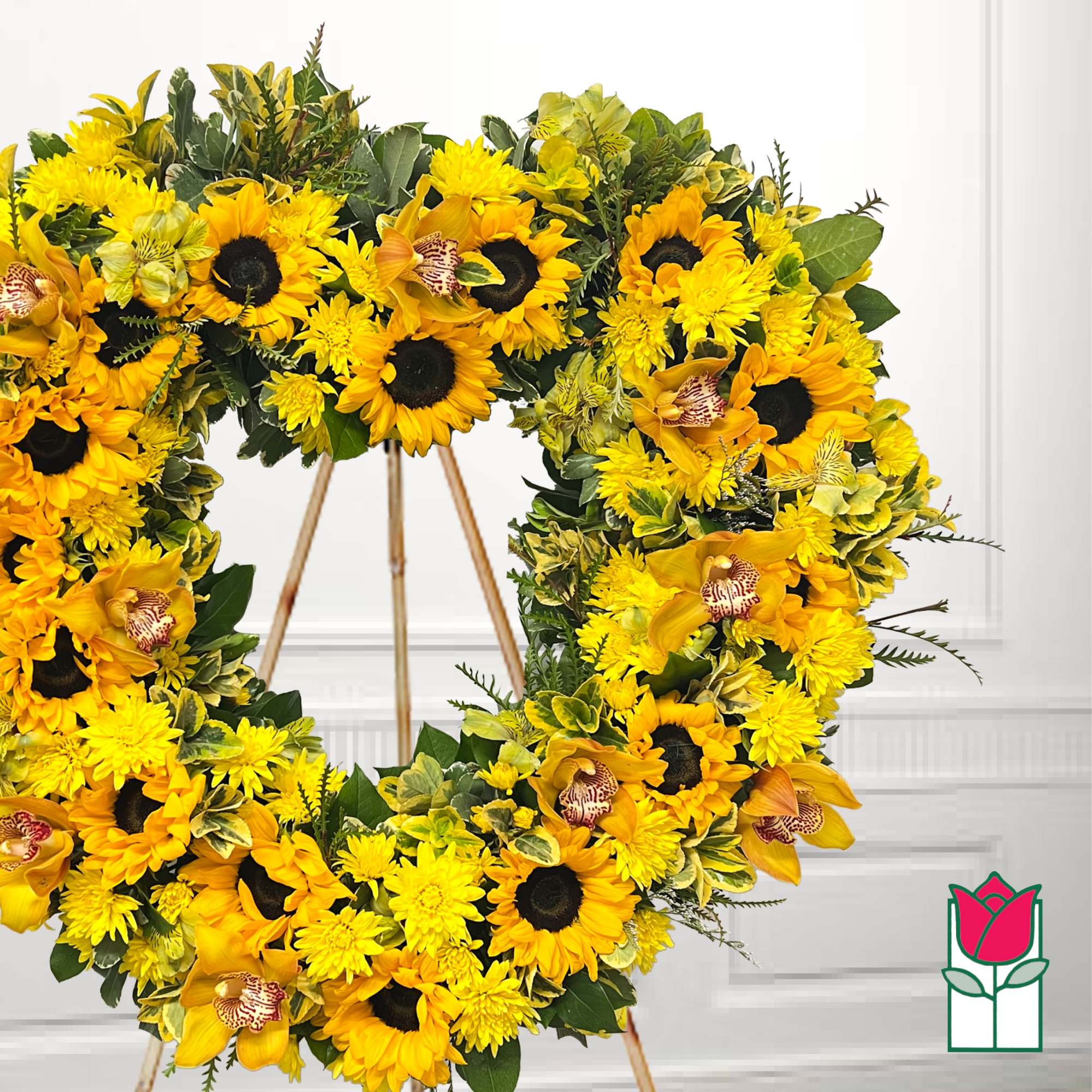Yellow sunflower wreath with orchids on a stand