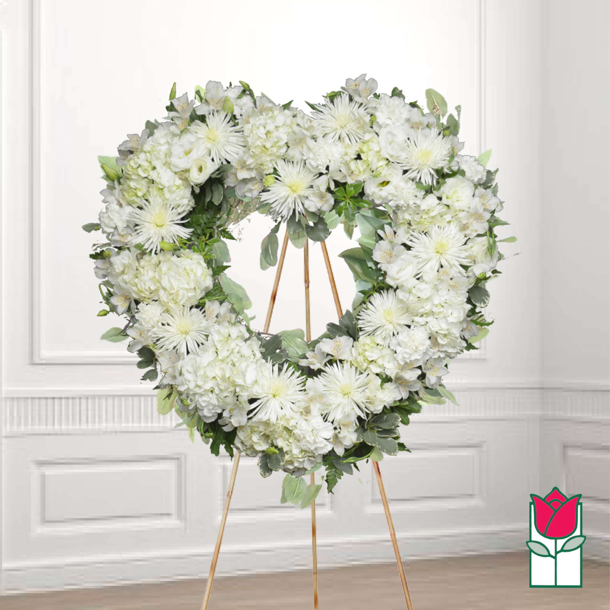White floral heart wreath on a gold easel