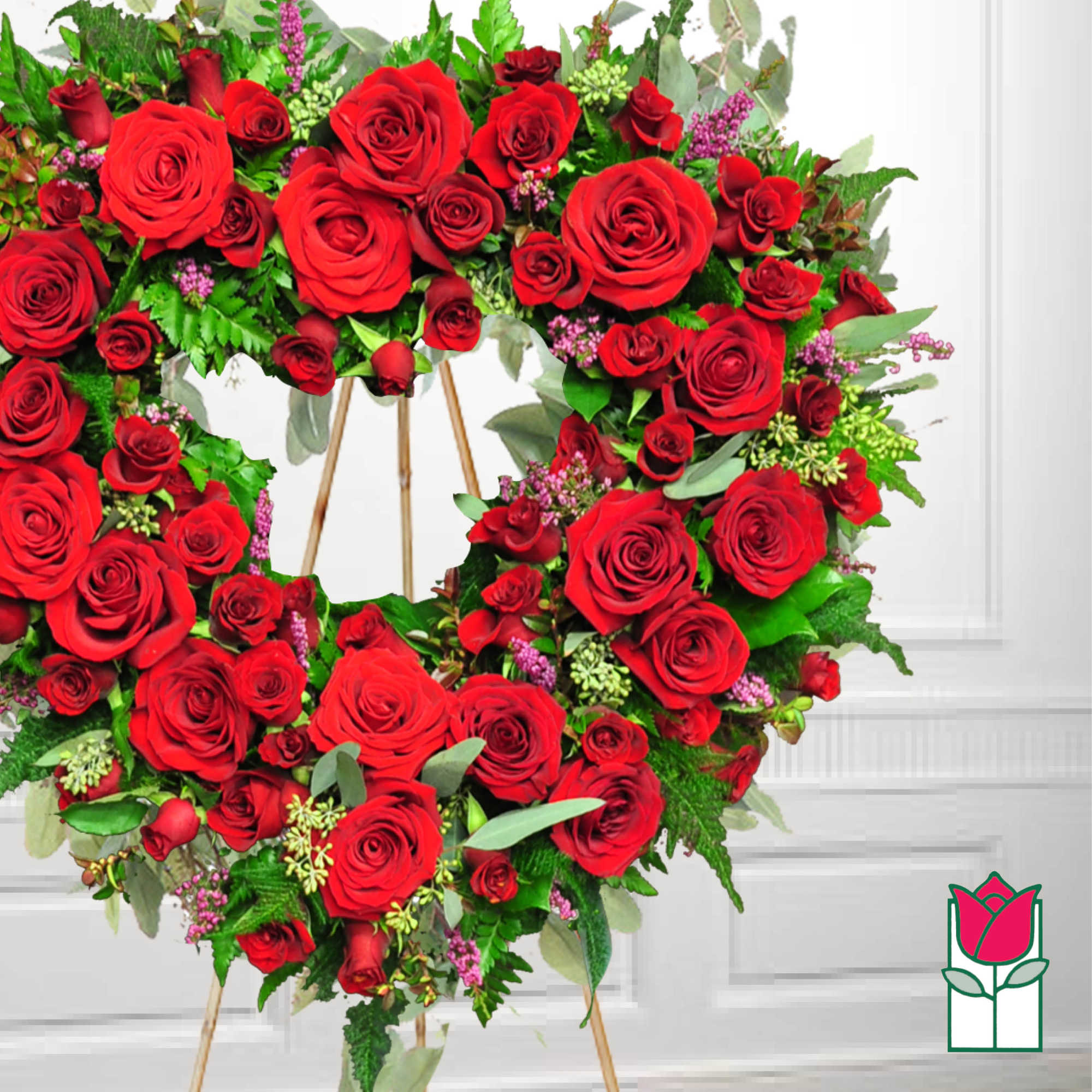 Heart-shaped wreath of red roses on a stand, photo 2 of 2