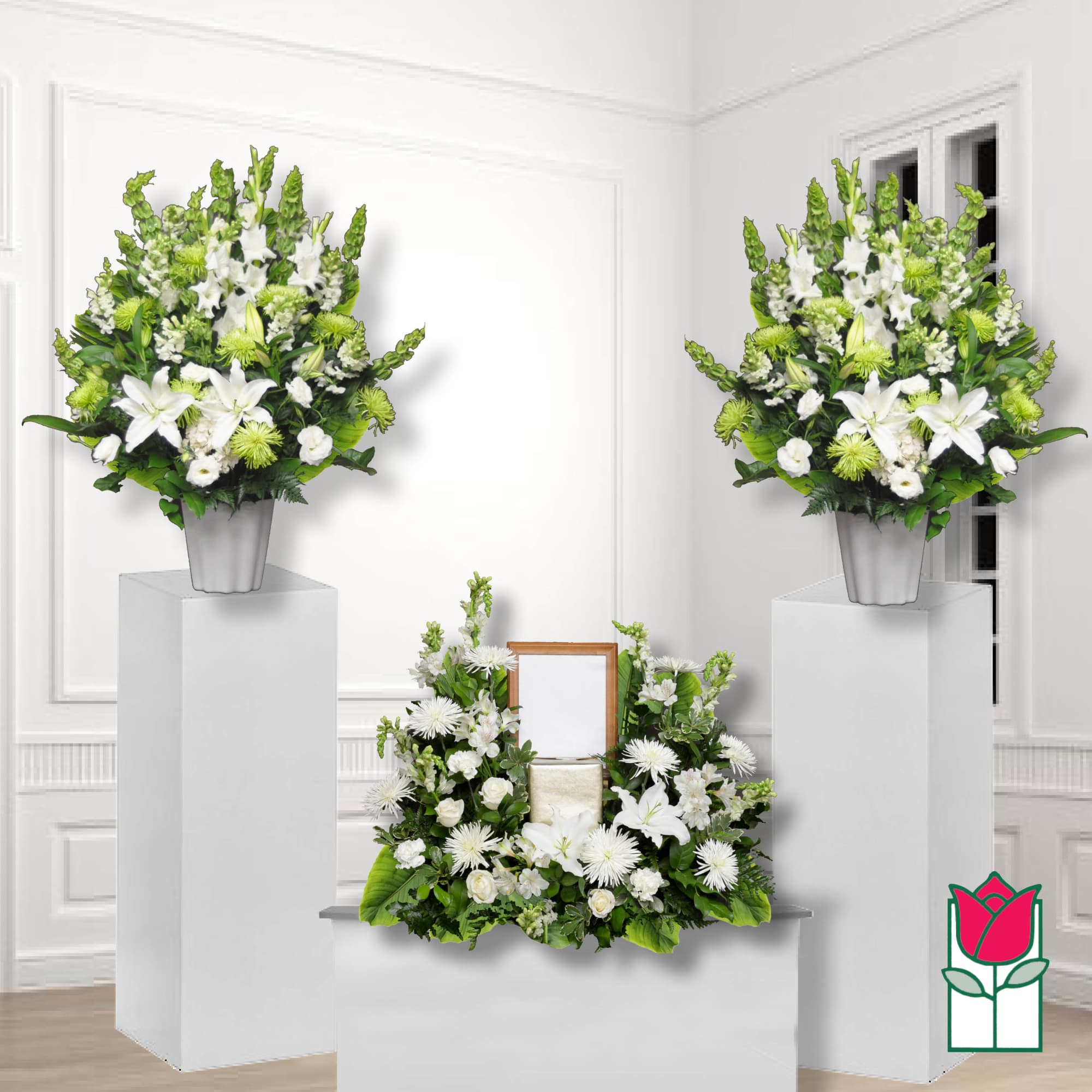 White floral funeral display with lilies and chrysanthemums on pedestals
