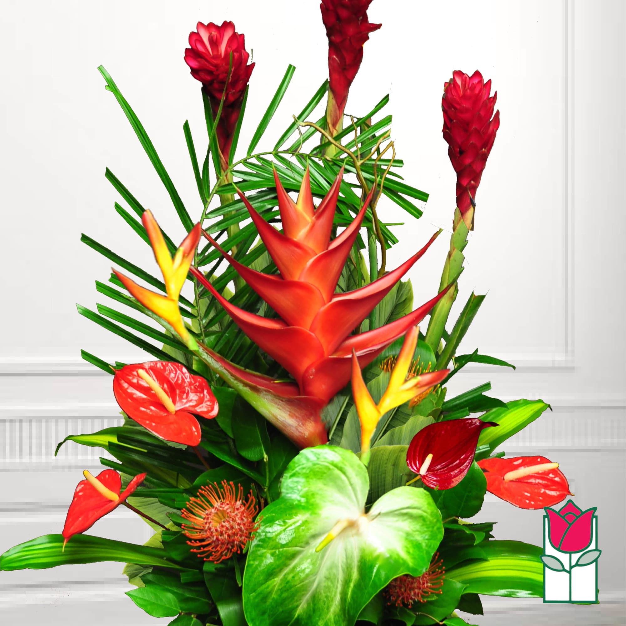 Tropical arrangement with red heliconia, anthuriums, and green foliage