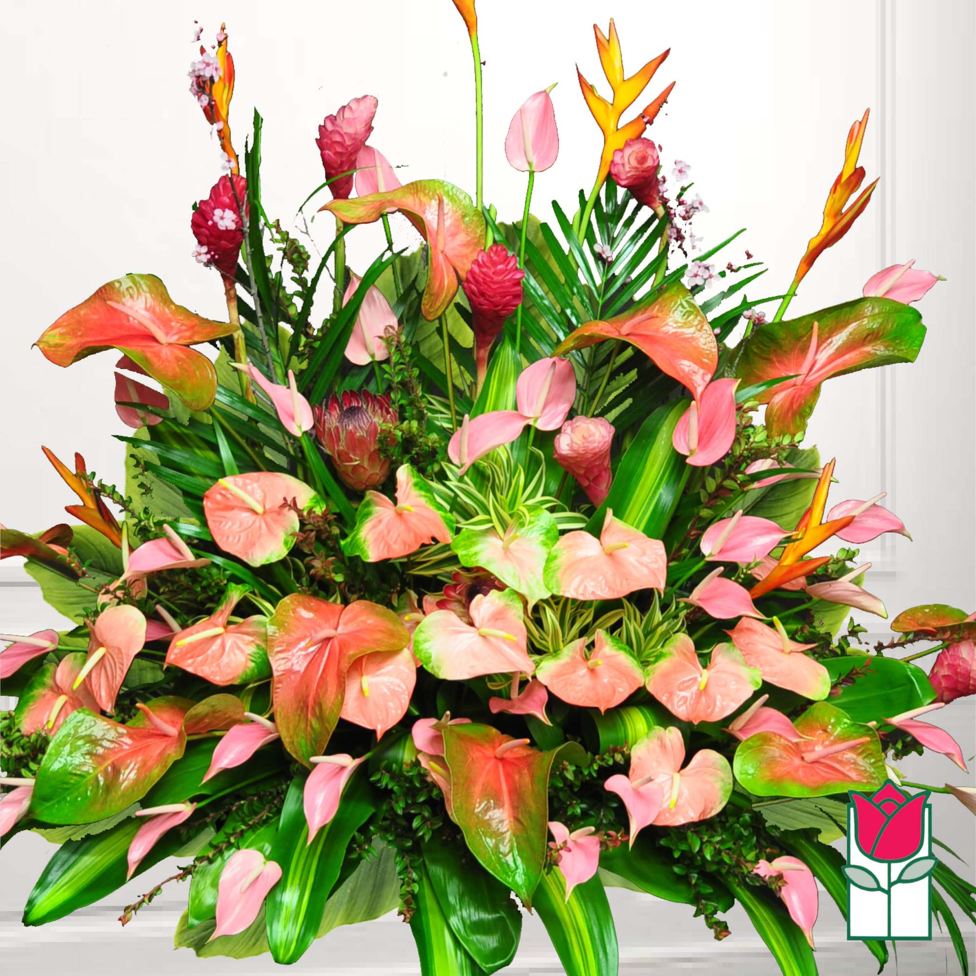 Large tropical floral arrangement with pink anthuriums and orange bird-of-paradise