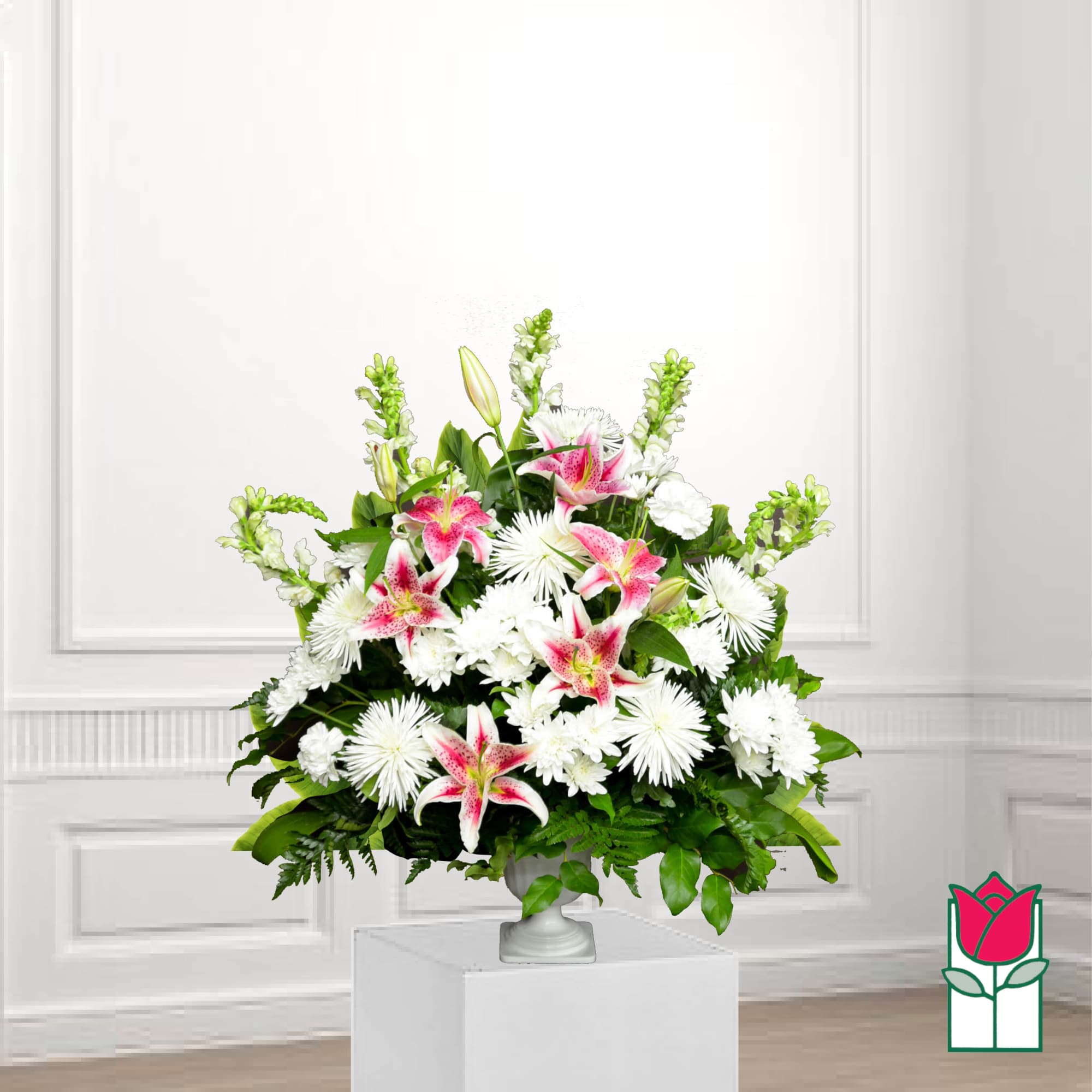 White and pink lily arrangement in a pedestal vase