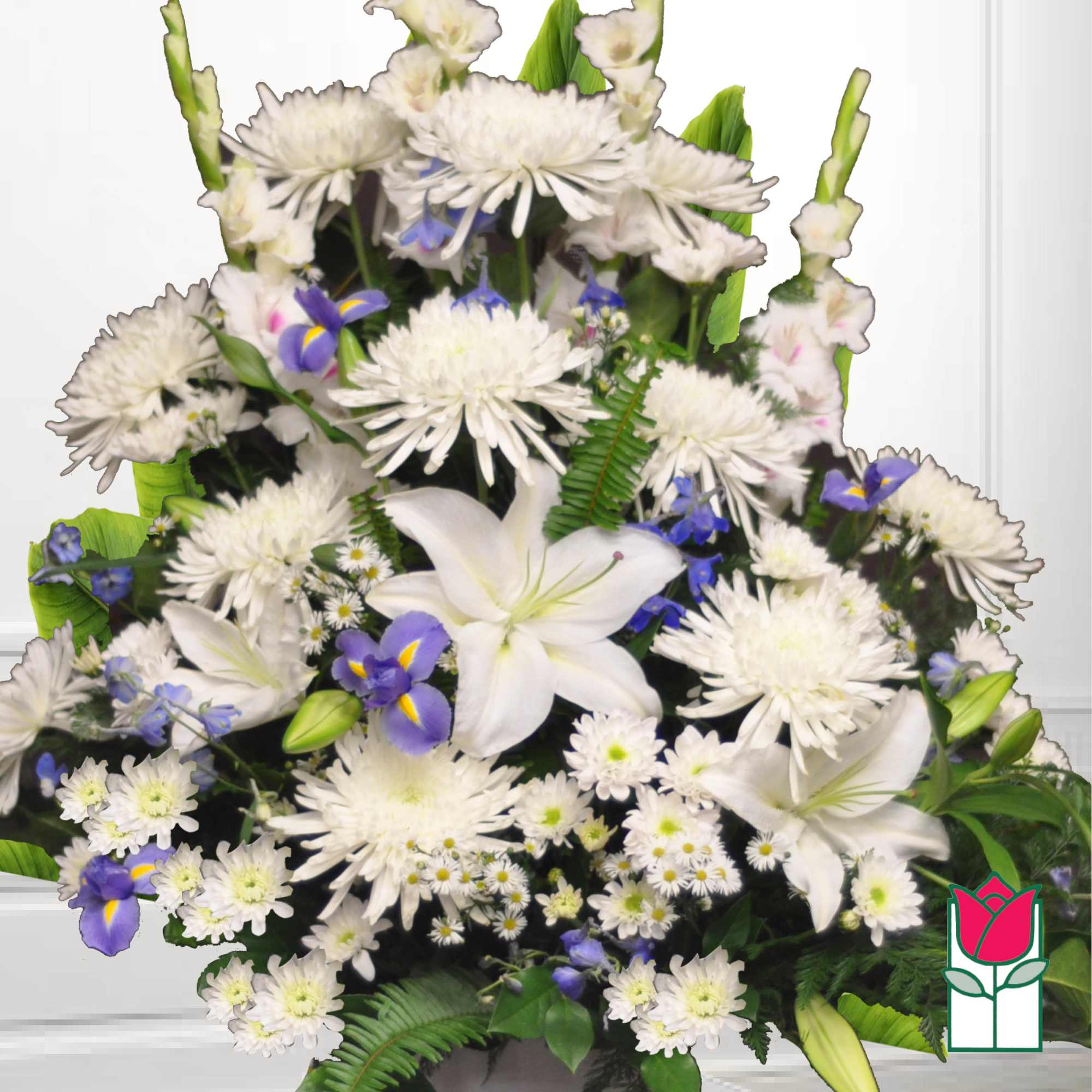 White lilies and daisies with purple iris in a large arrangement