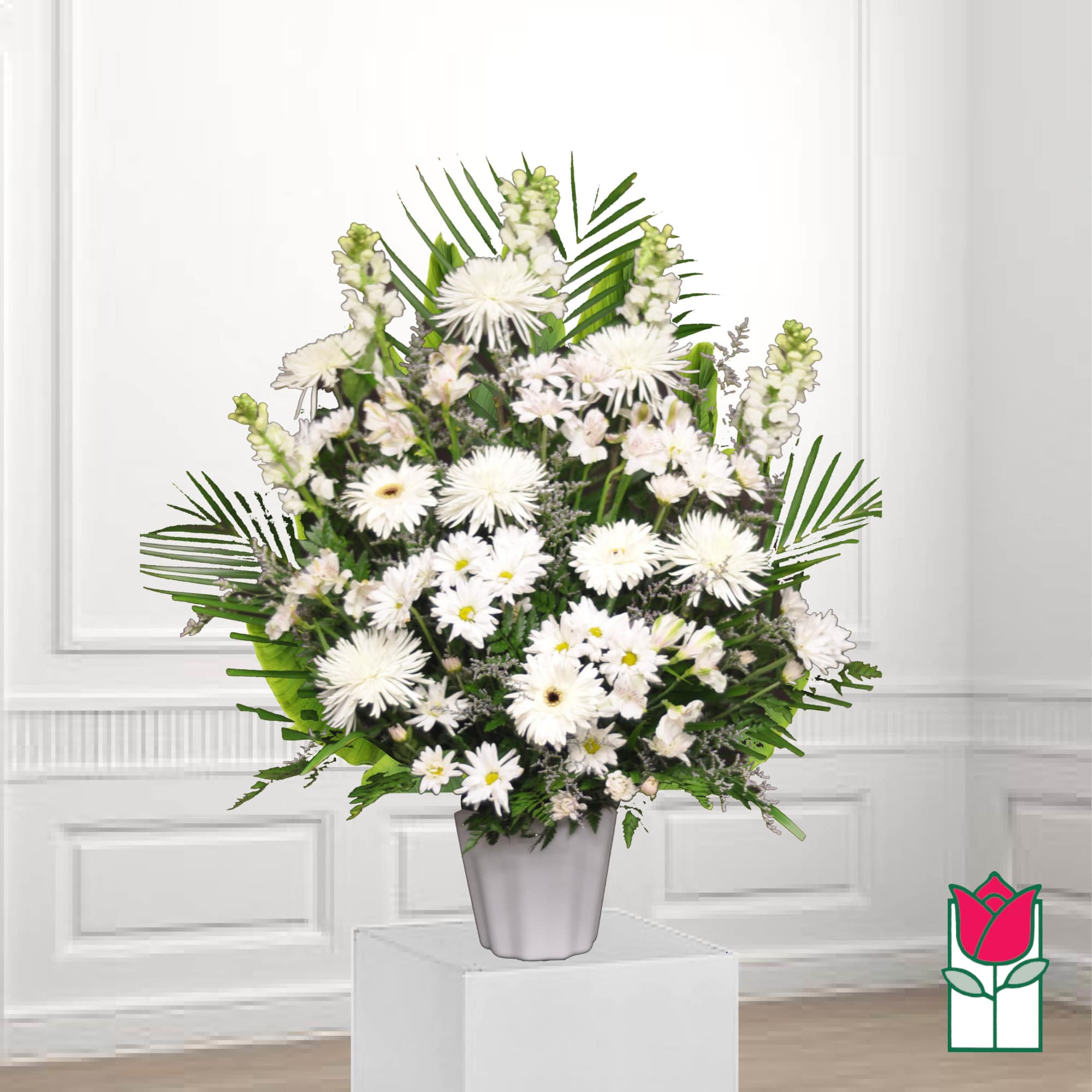 White daisy bouquet in a gray vase with palm leaves