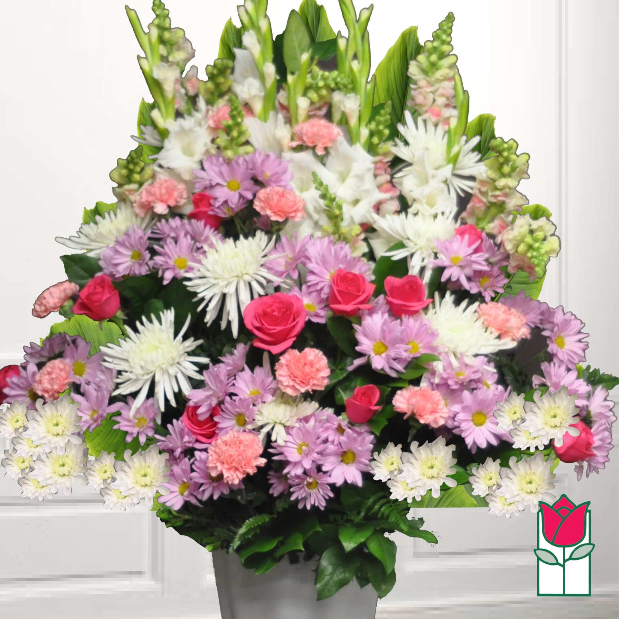 Large mixed bouquet in a gray container with pink, white, and lavender flowers