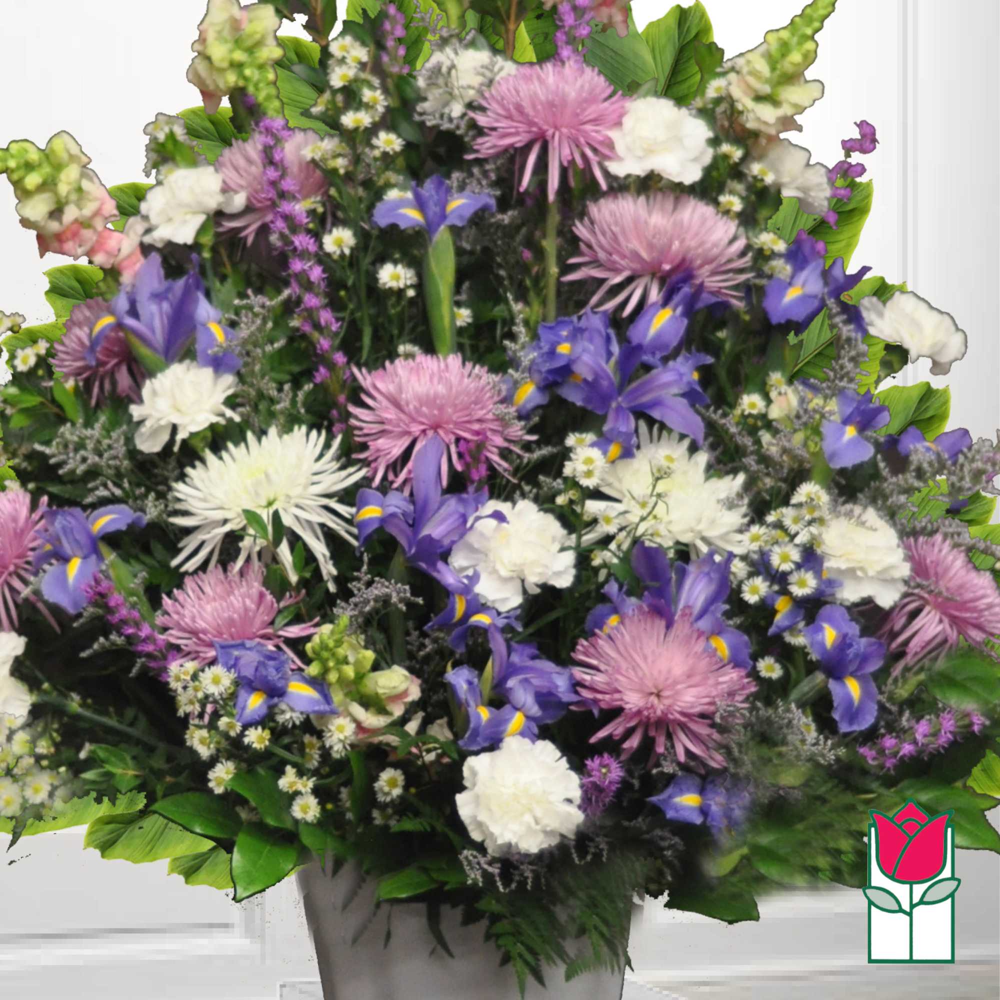 Mixed bouquet of purple, white, and pink flowers in a vase