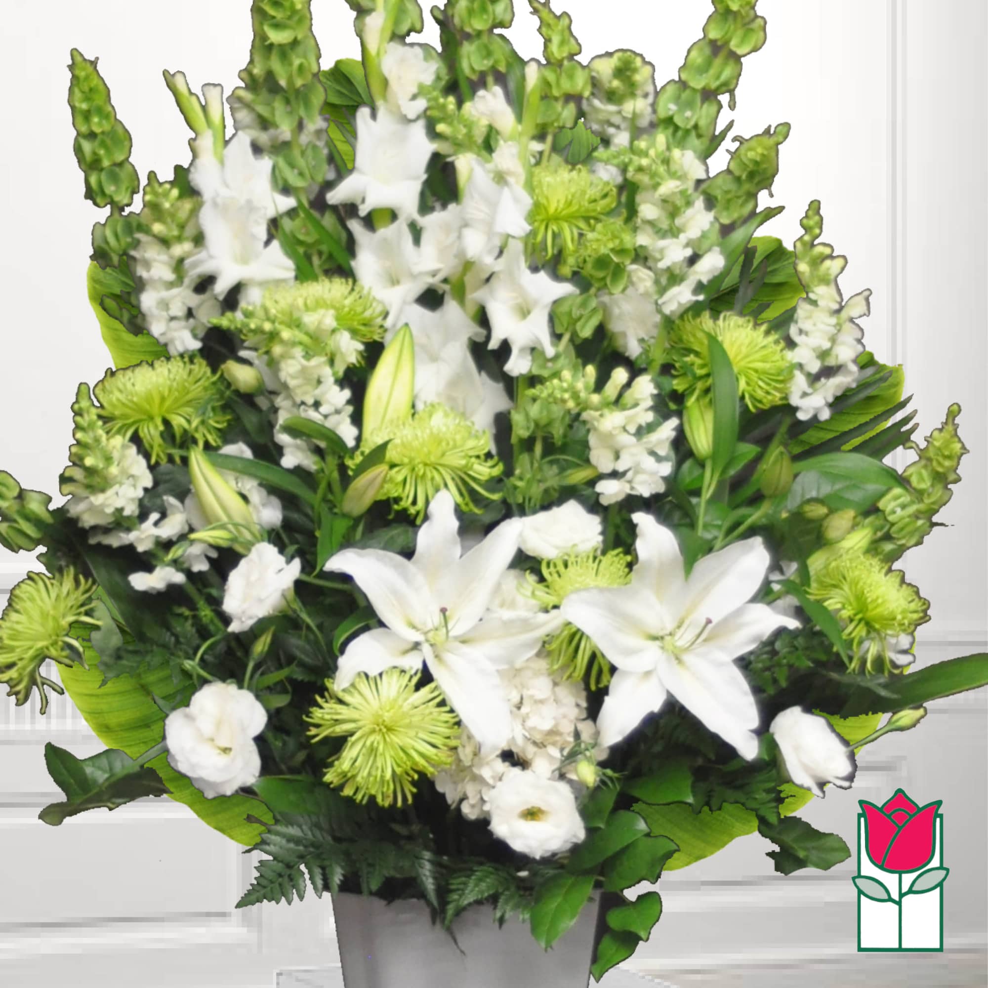 White lilies and green chrysanthemums in a gray vase