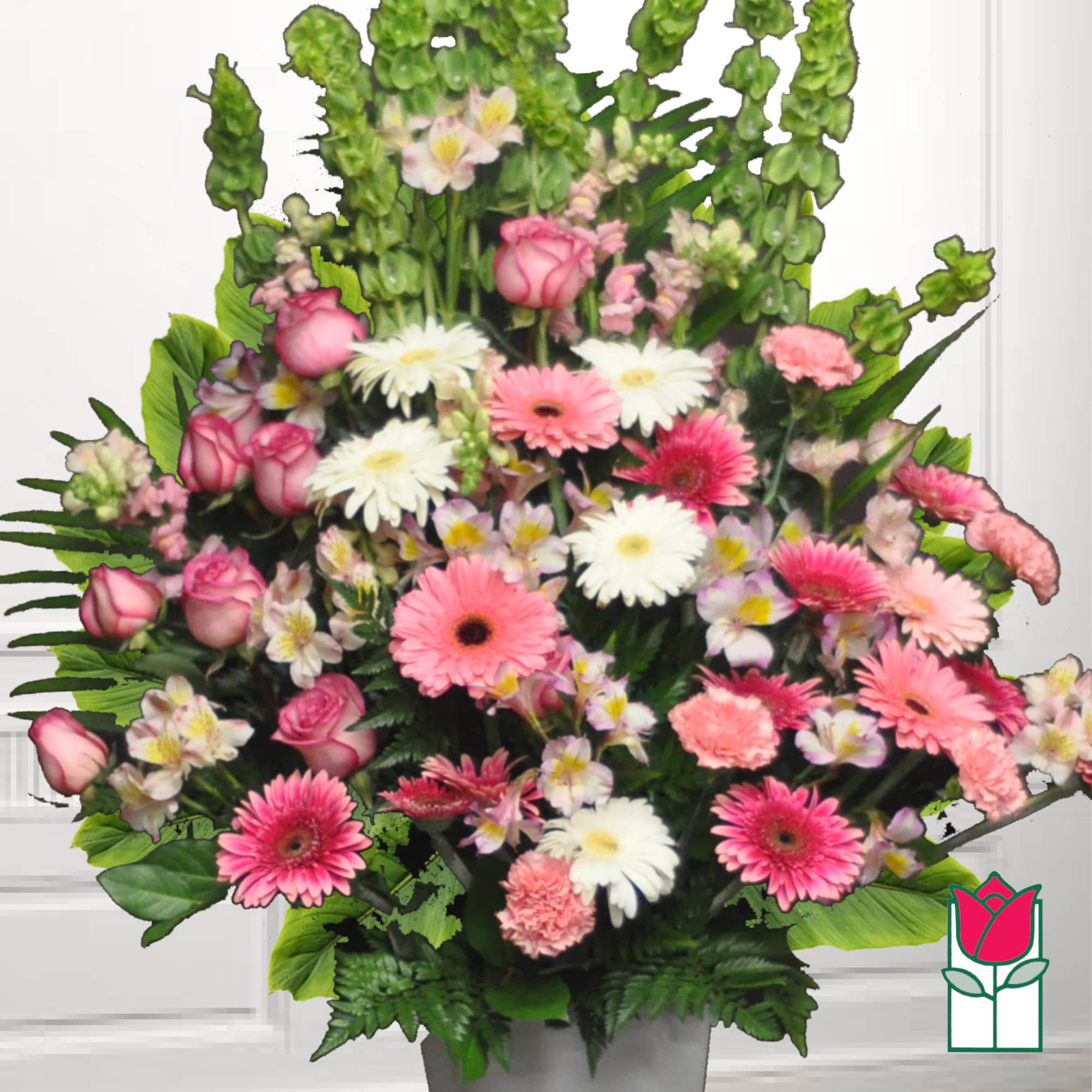 Pink and white mixed flower arrangement in a gray vase