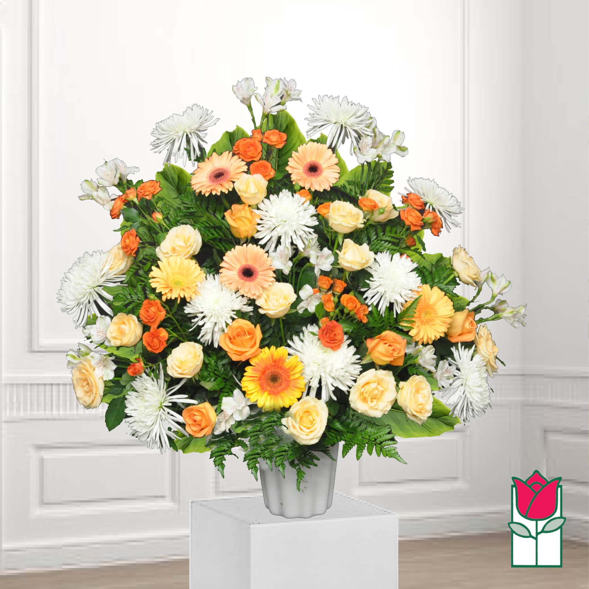 Large bouquet of orange and white flowers in a white vase