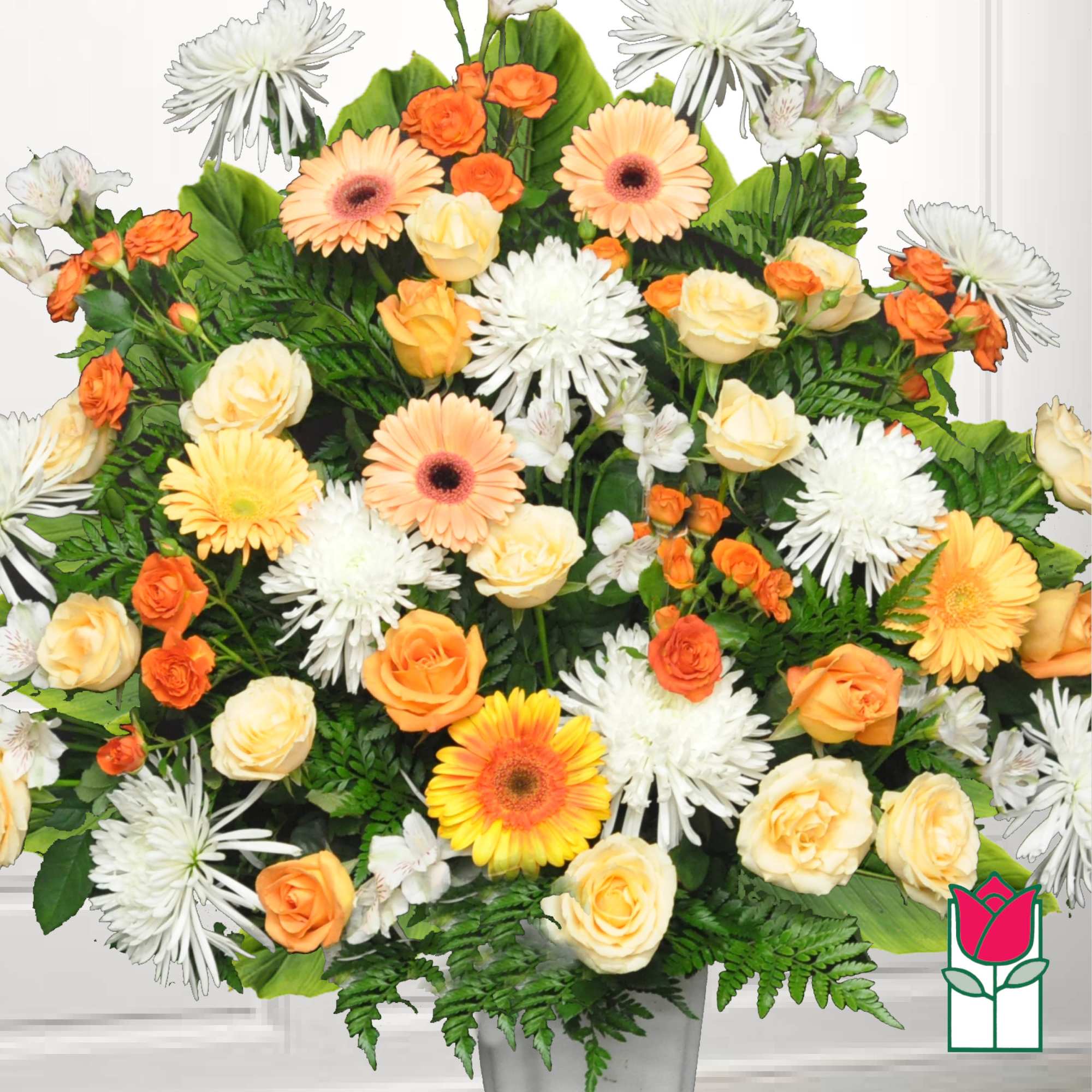 Mixed bouquet of orange and cream roses with white daisies in a vase