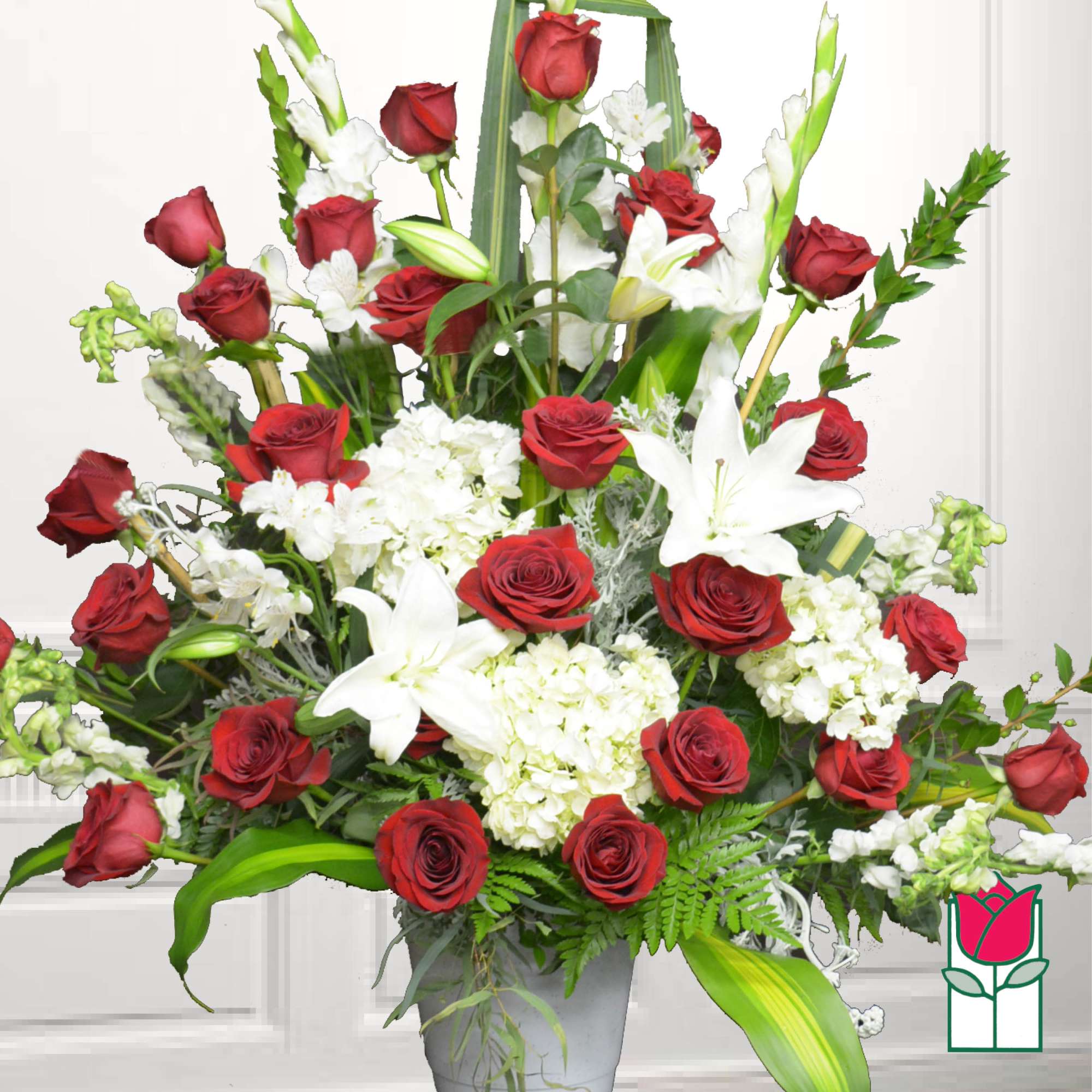 Red roses and white lilies in a gray vase