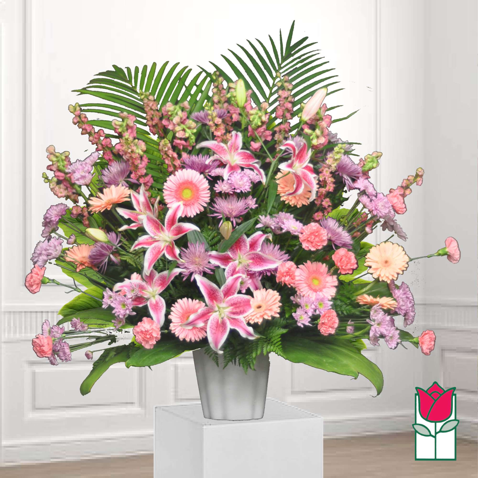 Pink and lavender mixed flower arrangement in a silver vase