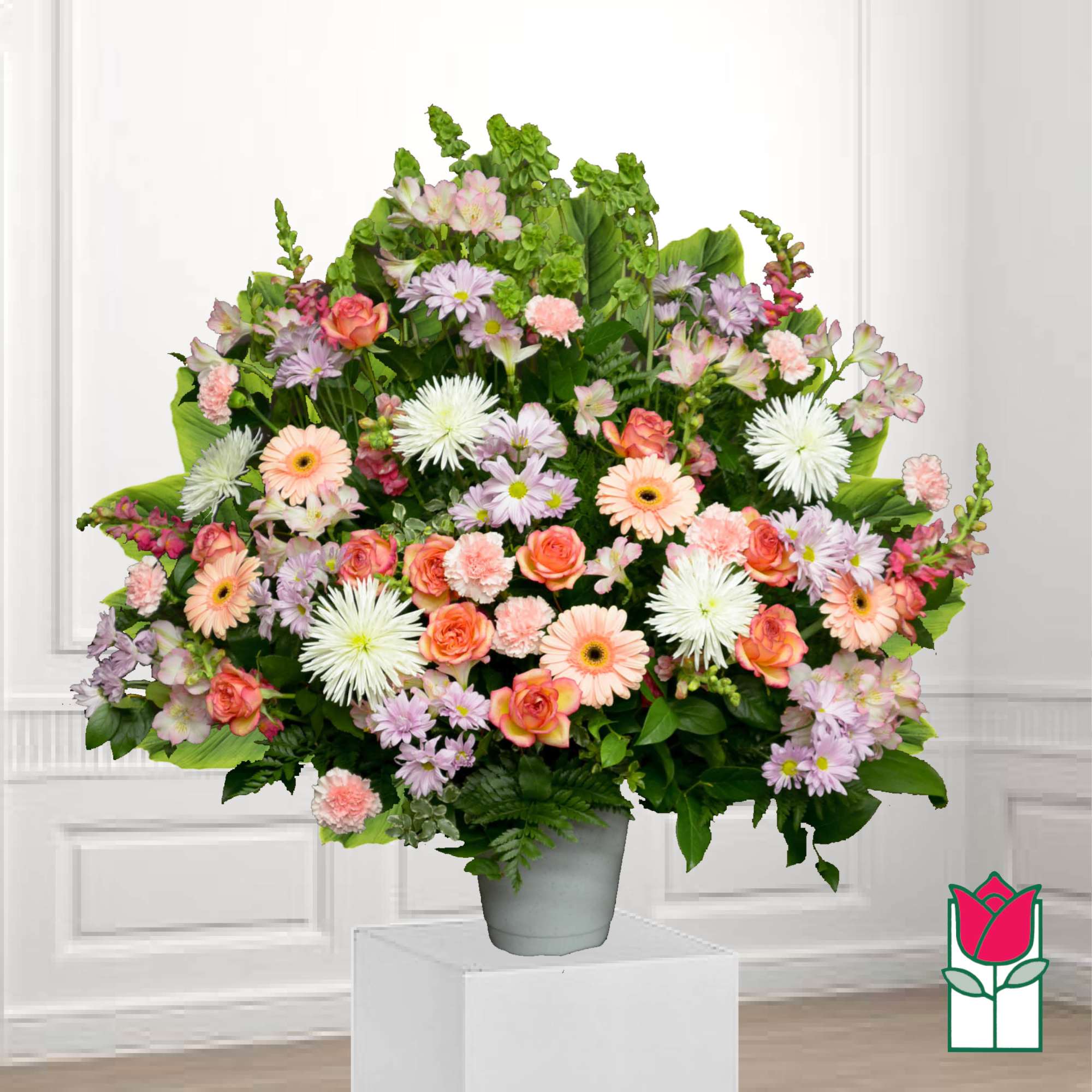 Large mixed bouquet in a gray vase with pink and white flowers