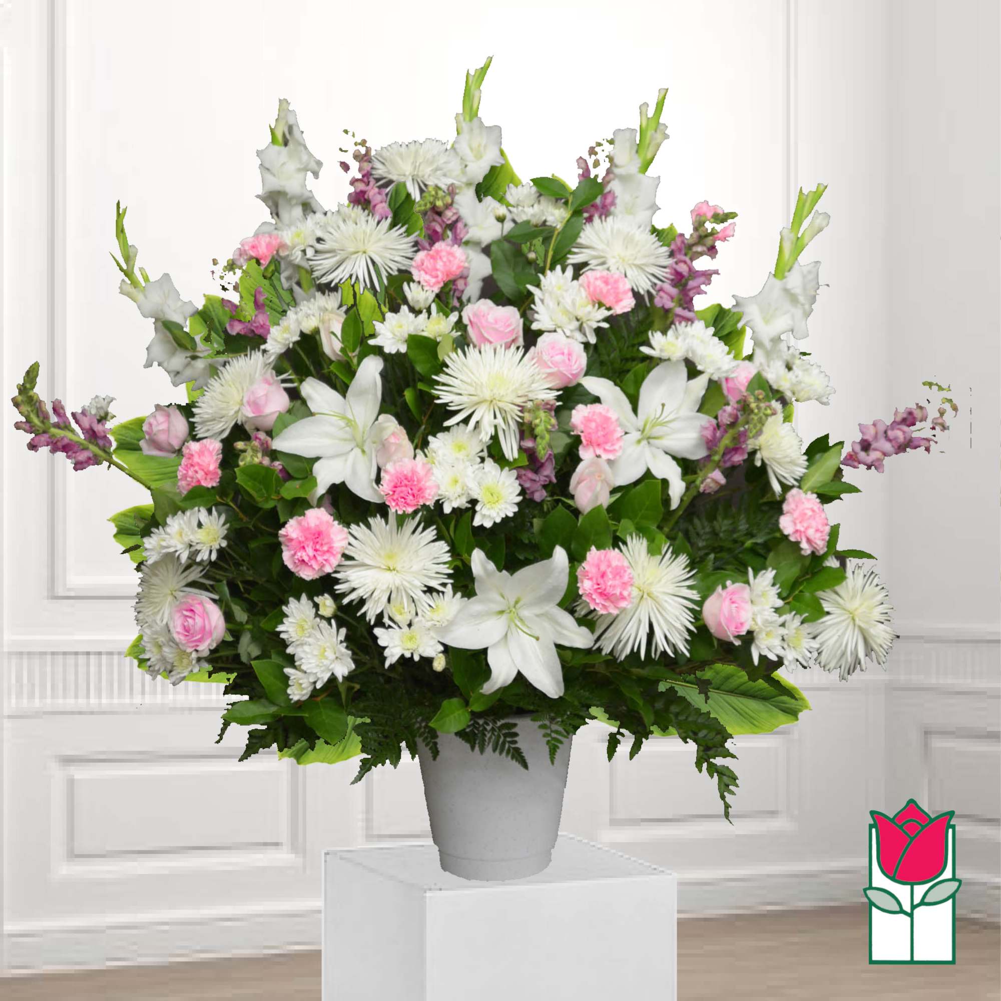 White and pink mixed flower arrangement in a gray vase