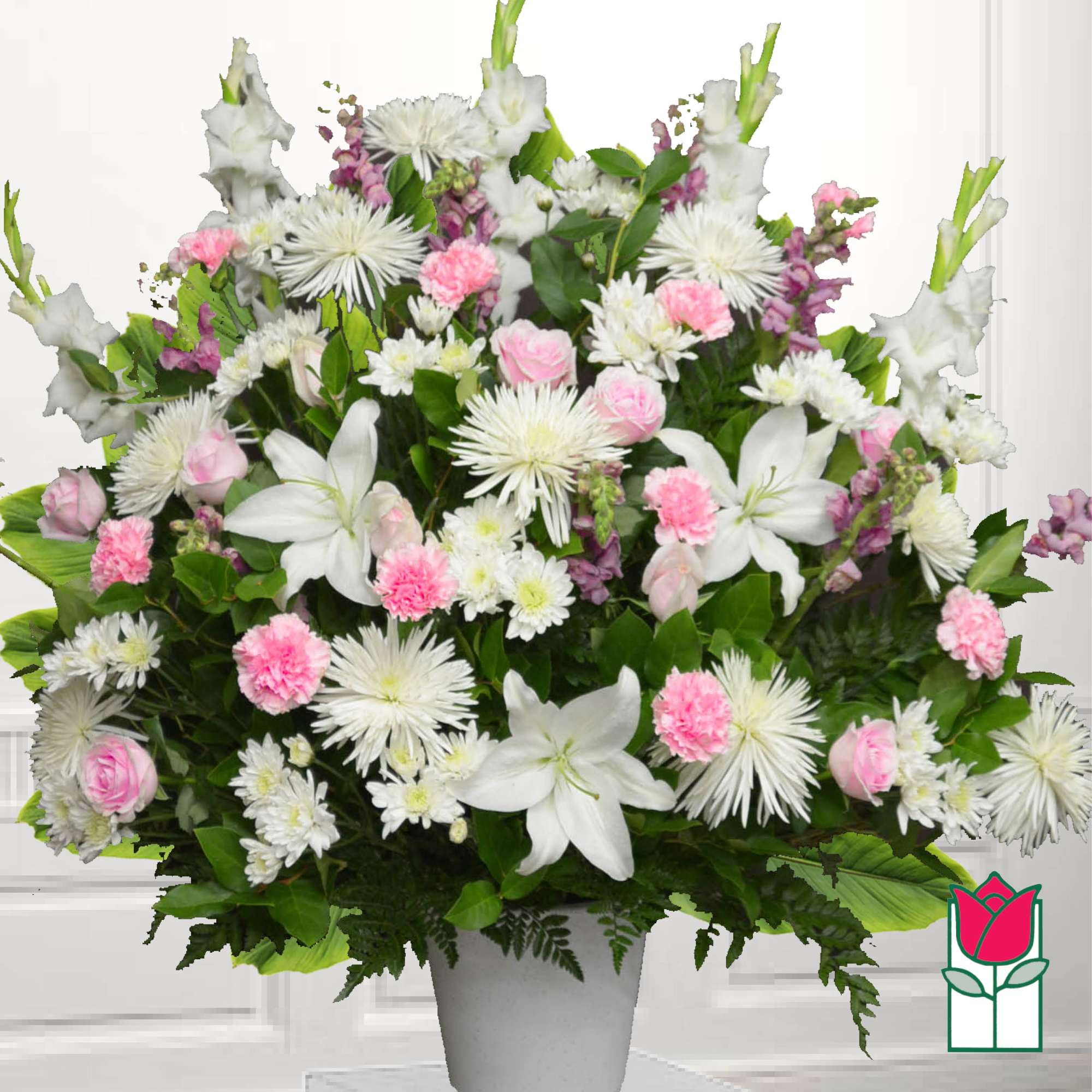 White lilies and pink carnations in a gray vase