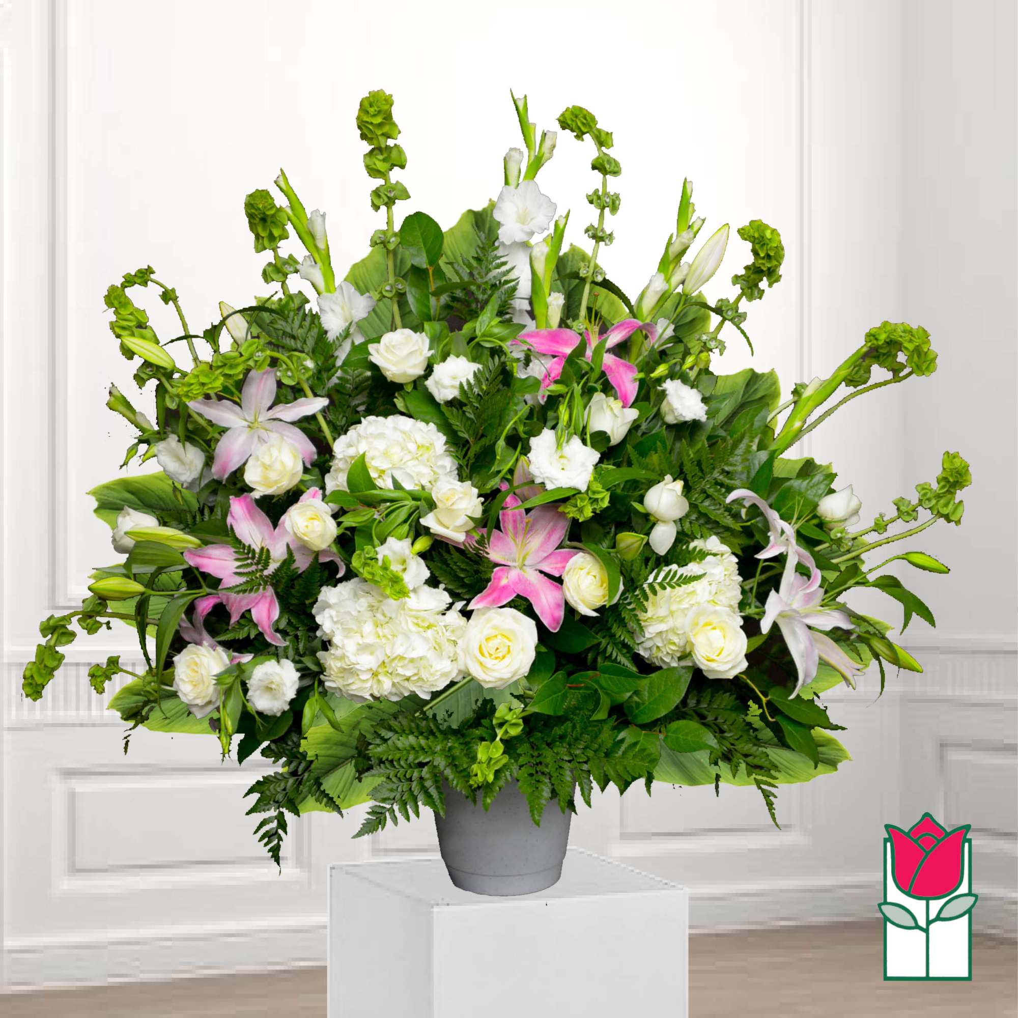 Large mixed floral arrangement in a gray vase with white and pink blooms