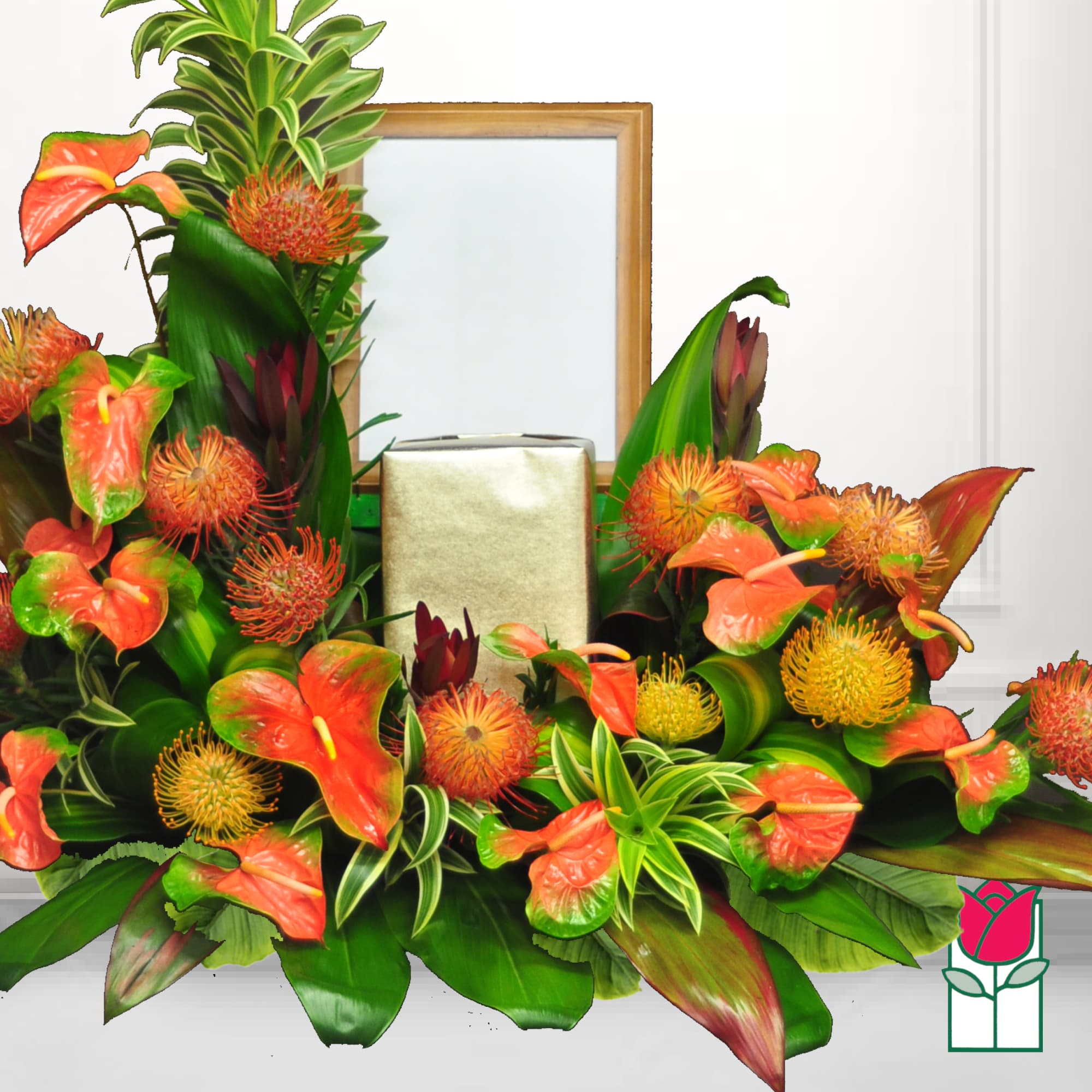 Tropical floral arrangement with orange anthuriums and spiky blooms around a gold box