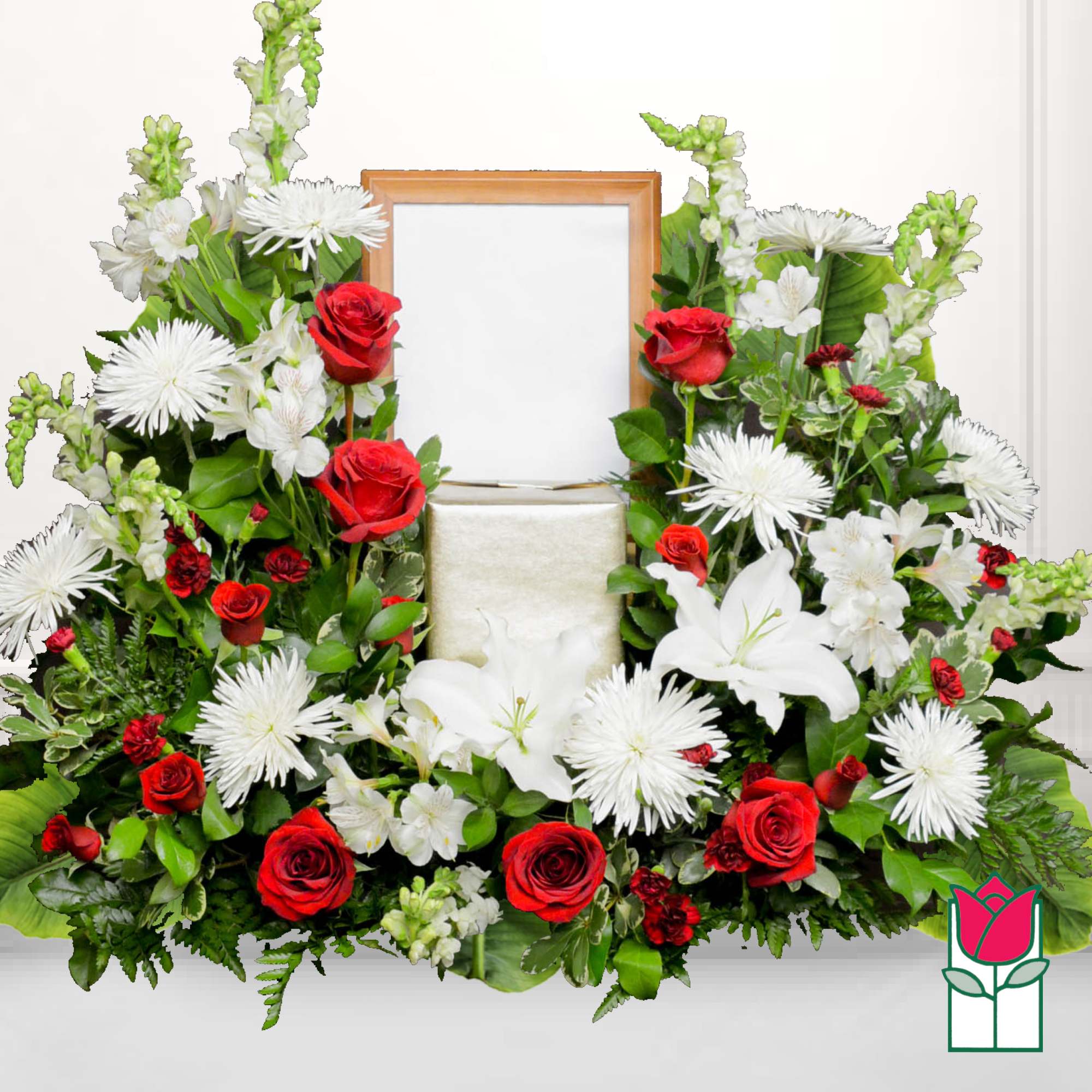 Red roses and white lilies arranged around a framed center opening